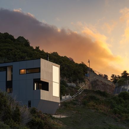 A distinctive bunker-like residence commands attention nestled in the hills of Christchurch
