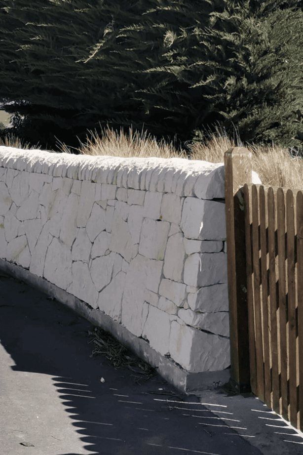 Limestone is often distinguished by its off-white colour, given to it by its calcite composition.