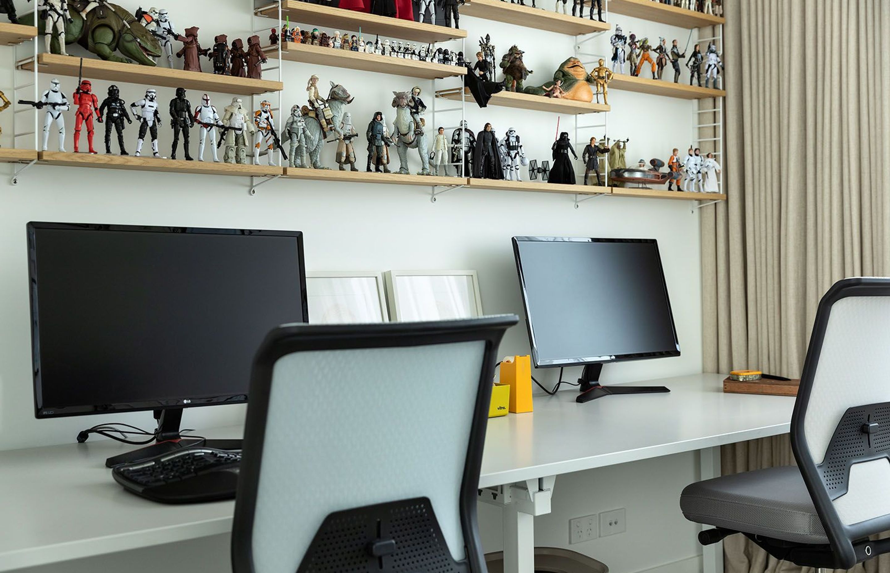 The upstairs' study/office features a collection of Star Wars figurines.