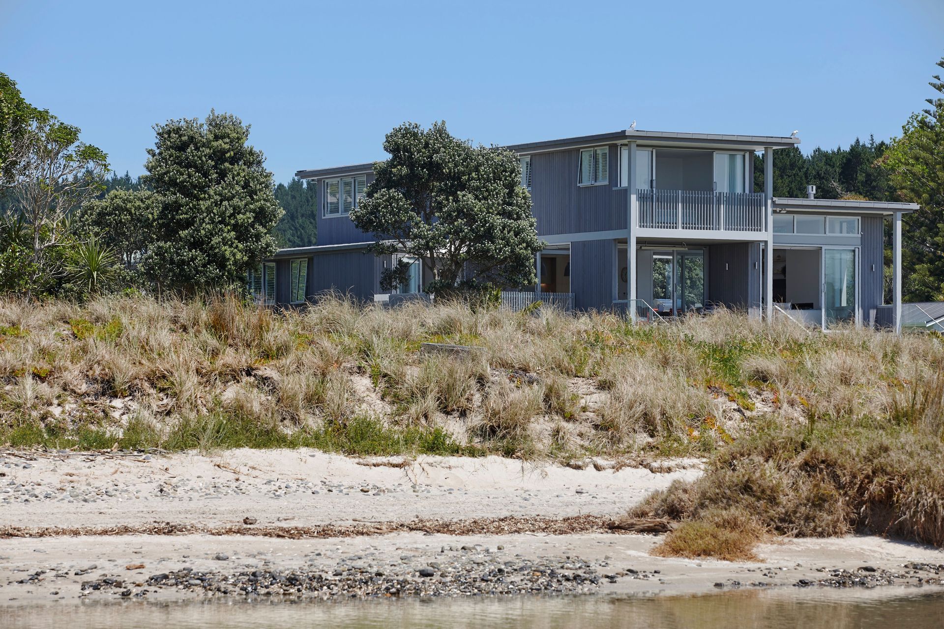 Kate says it’s important a house doesn’t look brand new and out of place. “We don't want a house to look like it's just arrived. In this case, it's kind of dipped in the sand, it's dipped in those grasses on the beach.”