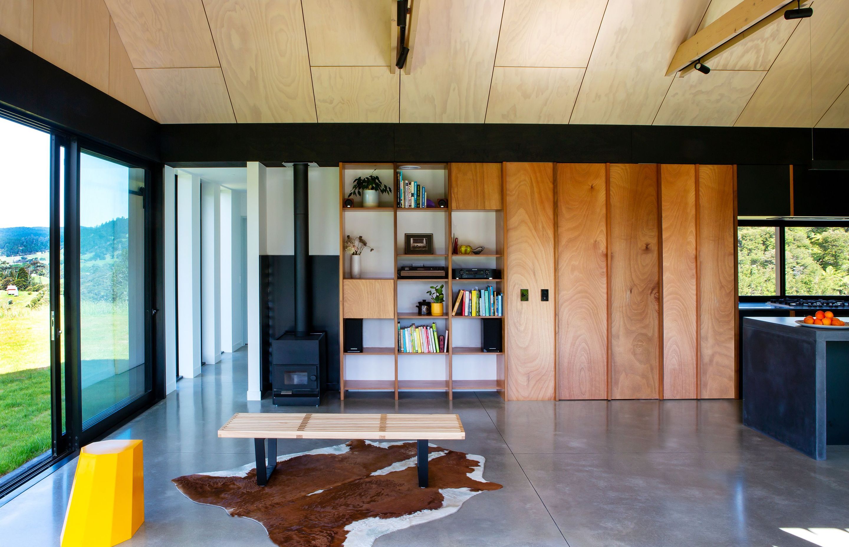 An exposed concrete slab is combined with simple materials dominated by timber with a whitewashed ply ceiling.