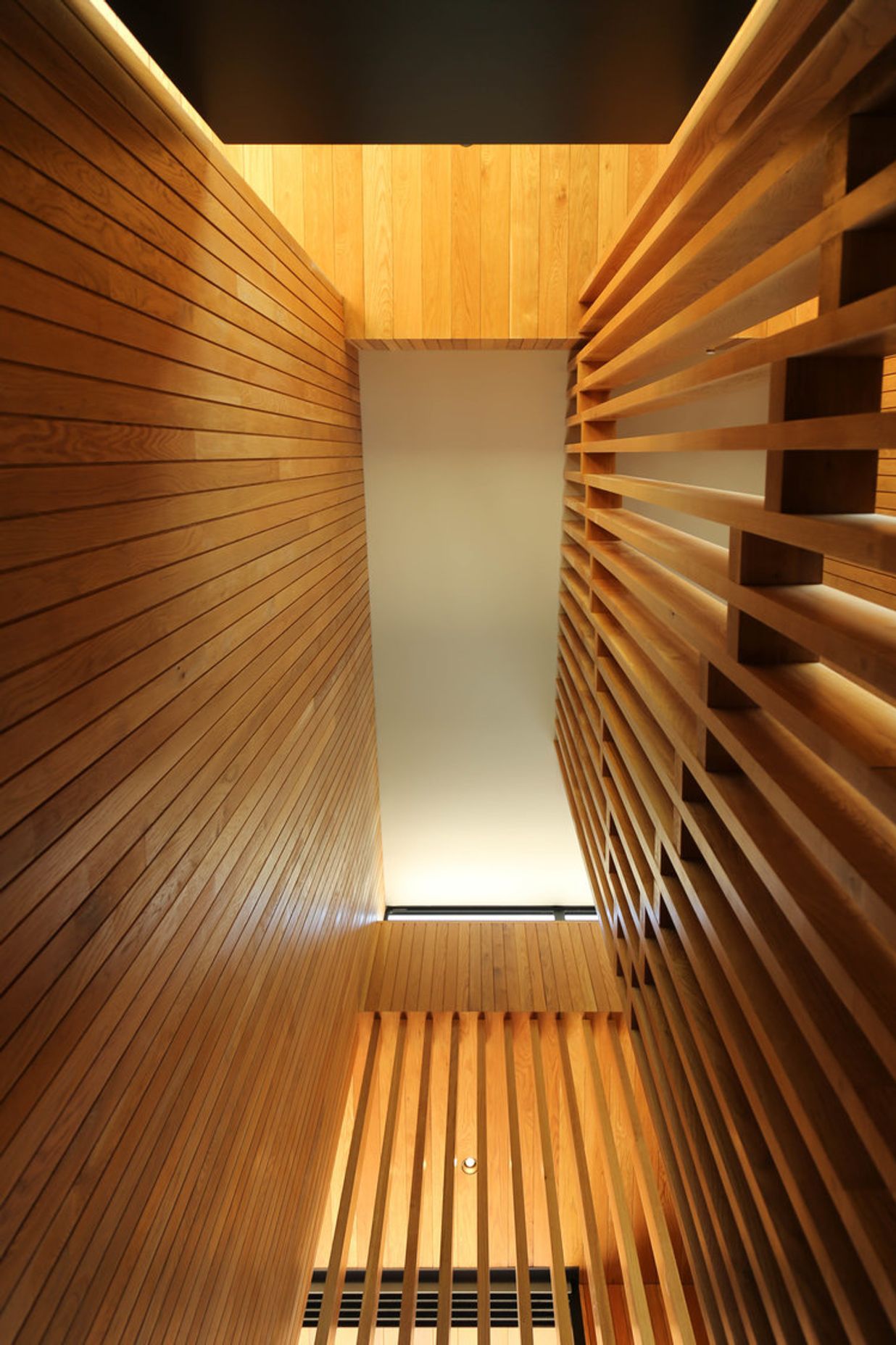 Looking up the 5m-high American oak timber staircase.