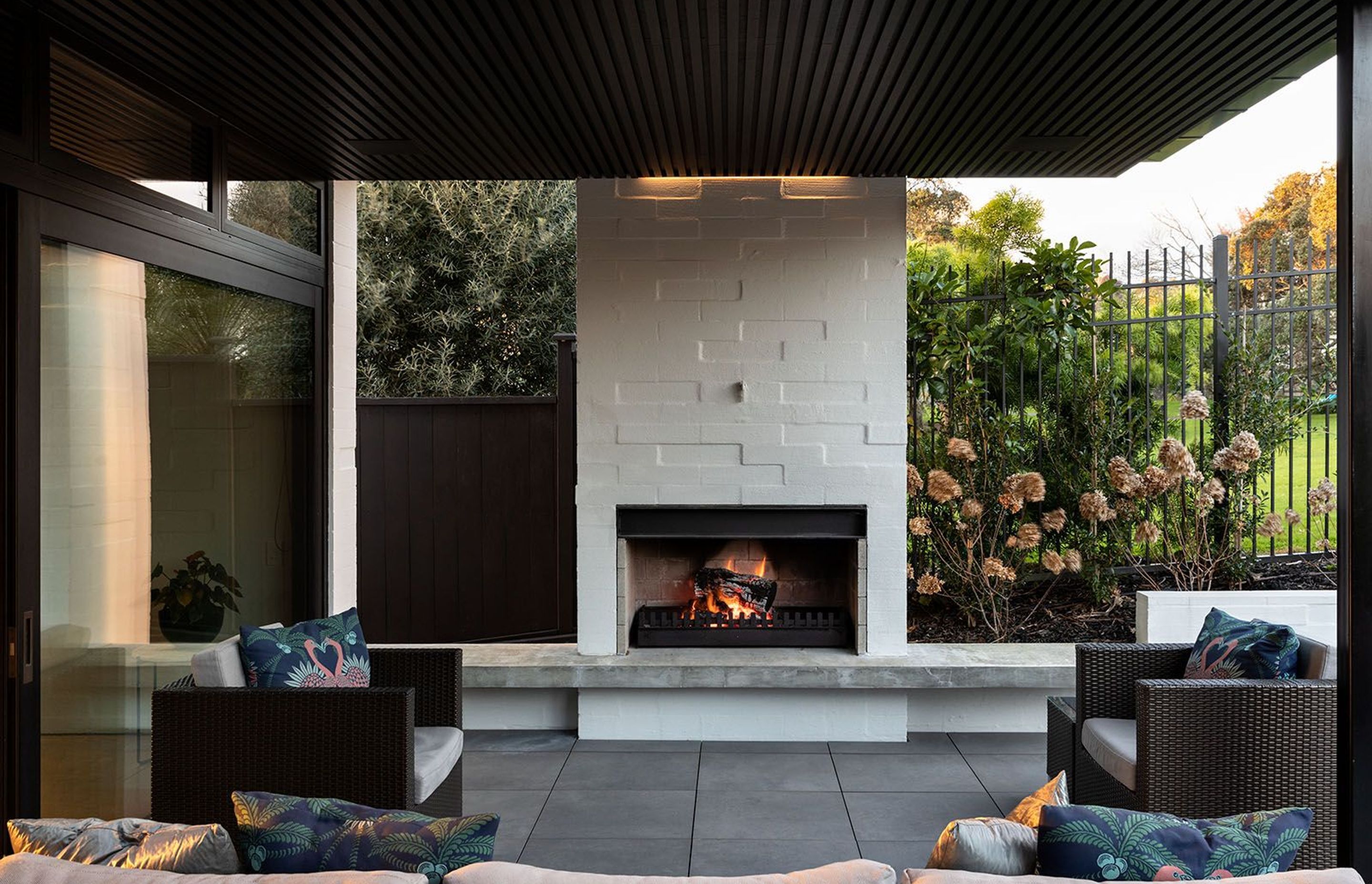The traditional nature of the concrete block fireplace brings an elemental feeling into the outdoor space.