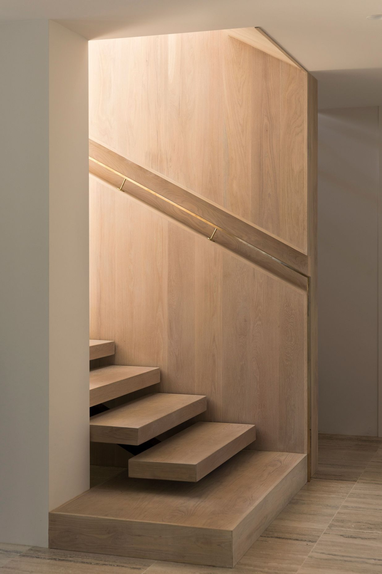 The staircase up to the first-floor living space and bedrooms.