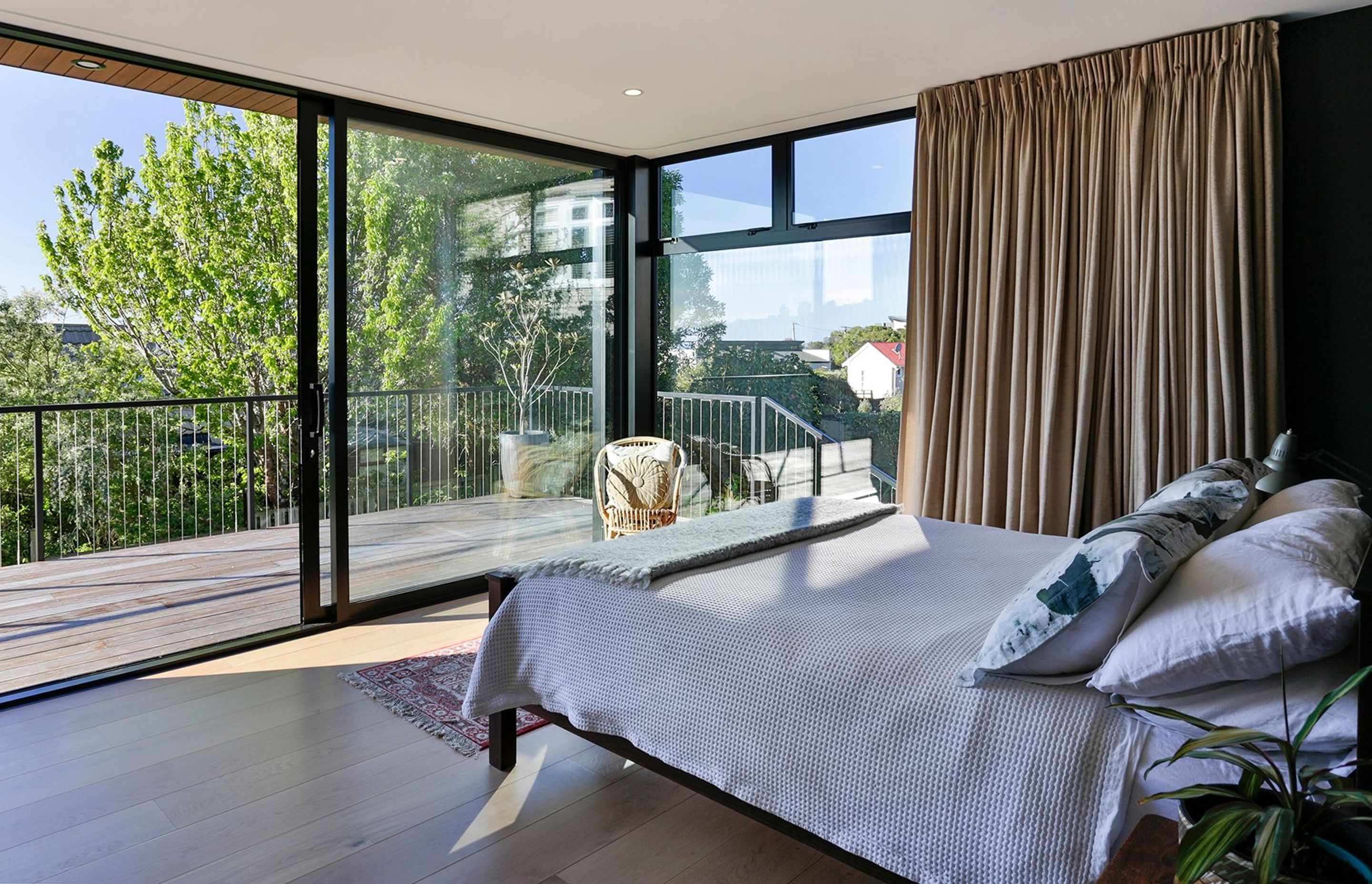 The bedroom opens up onto the main deck and the view.
