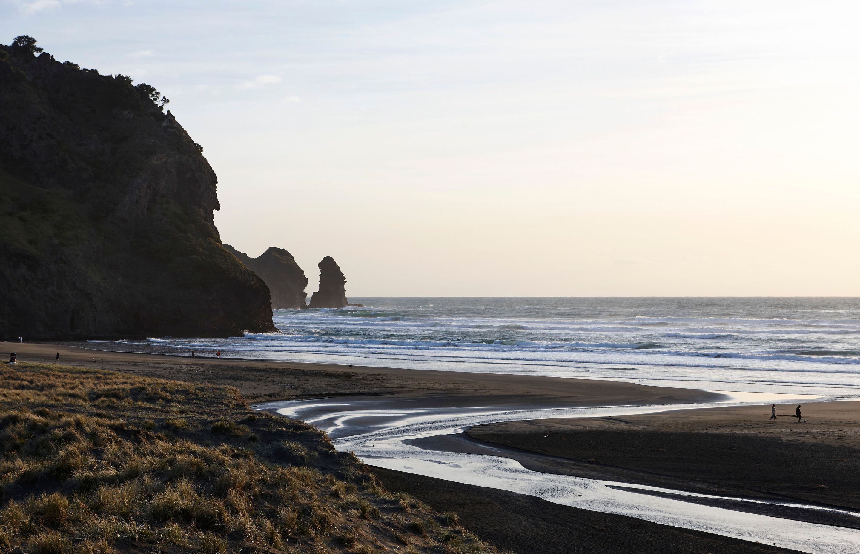 Piha: Black sand, relentless ocean, jagged basalt and a sky that dances between fiery white and violent seething black.