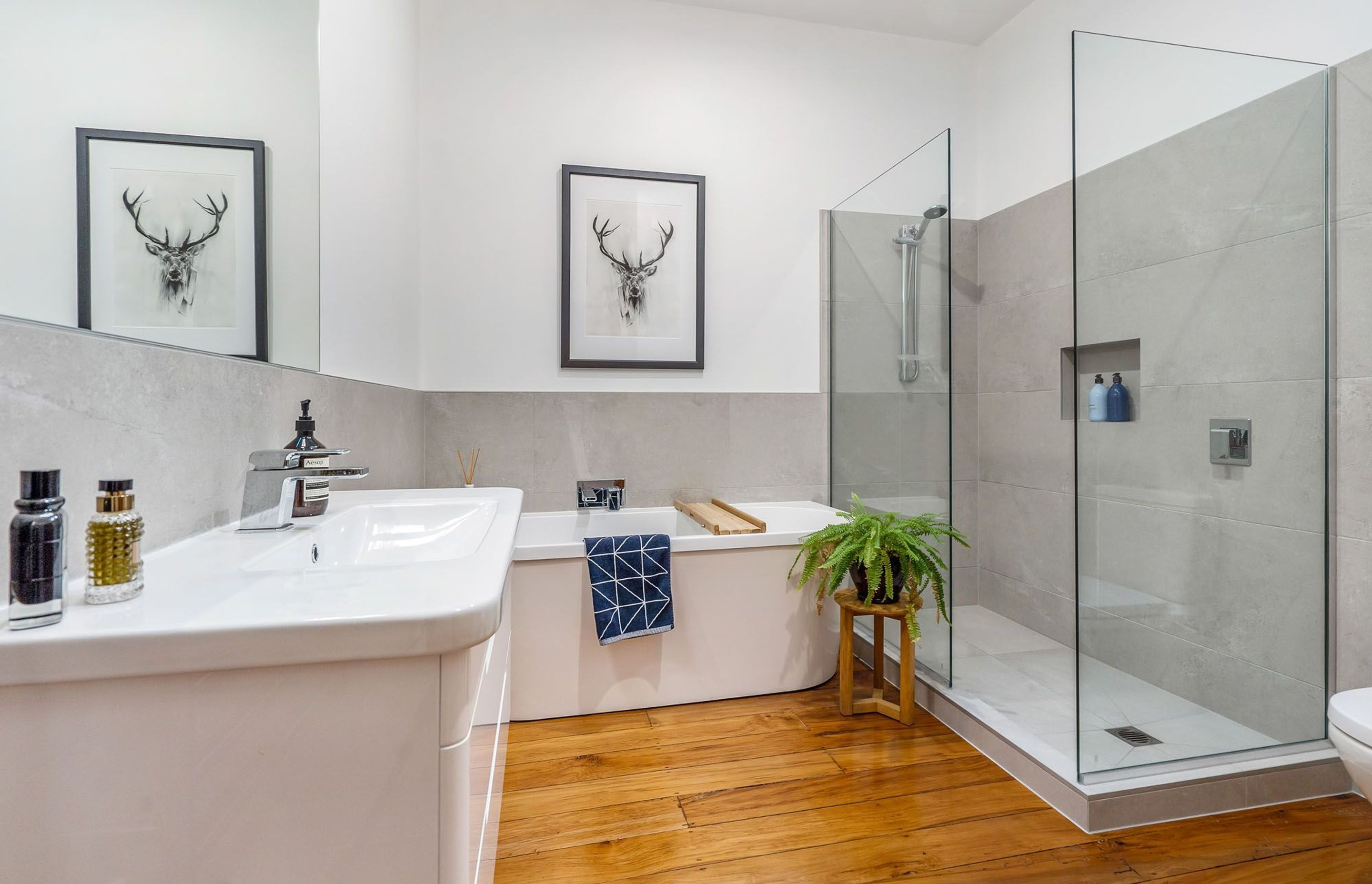 The feel in the refurbished main bathroom is very much one of graceful charm meets modern edge and reflects the home's nod to its roots while servicing modern living.