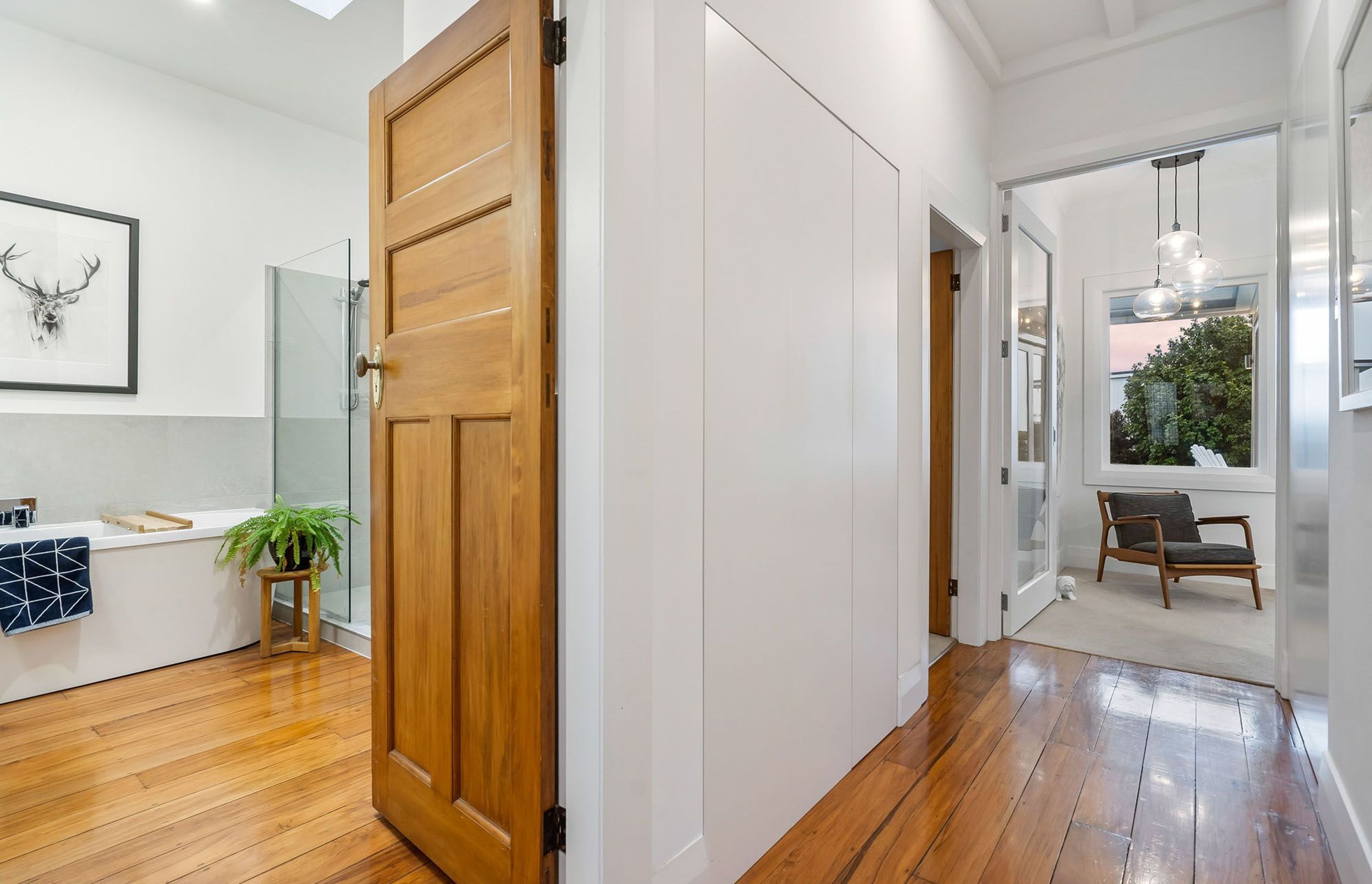 Part of the brief for the renovation was to increase the amount of storage but in an unobtrusive way. Flush-mounted doors without handles maintain the lines of the corridor without shouting 'cupboard'. All of the floorboards are reclaimed timbers and all 