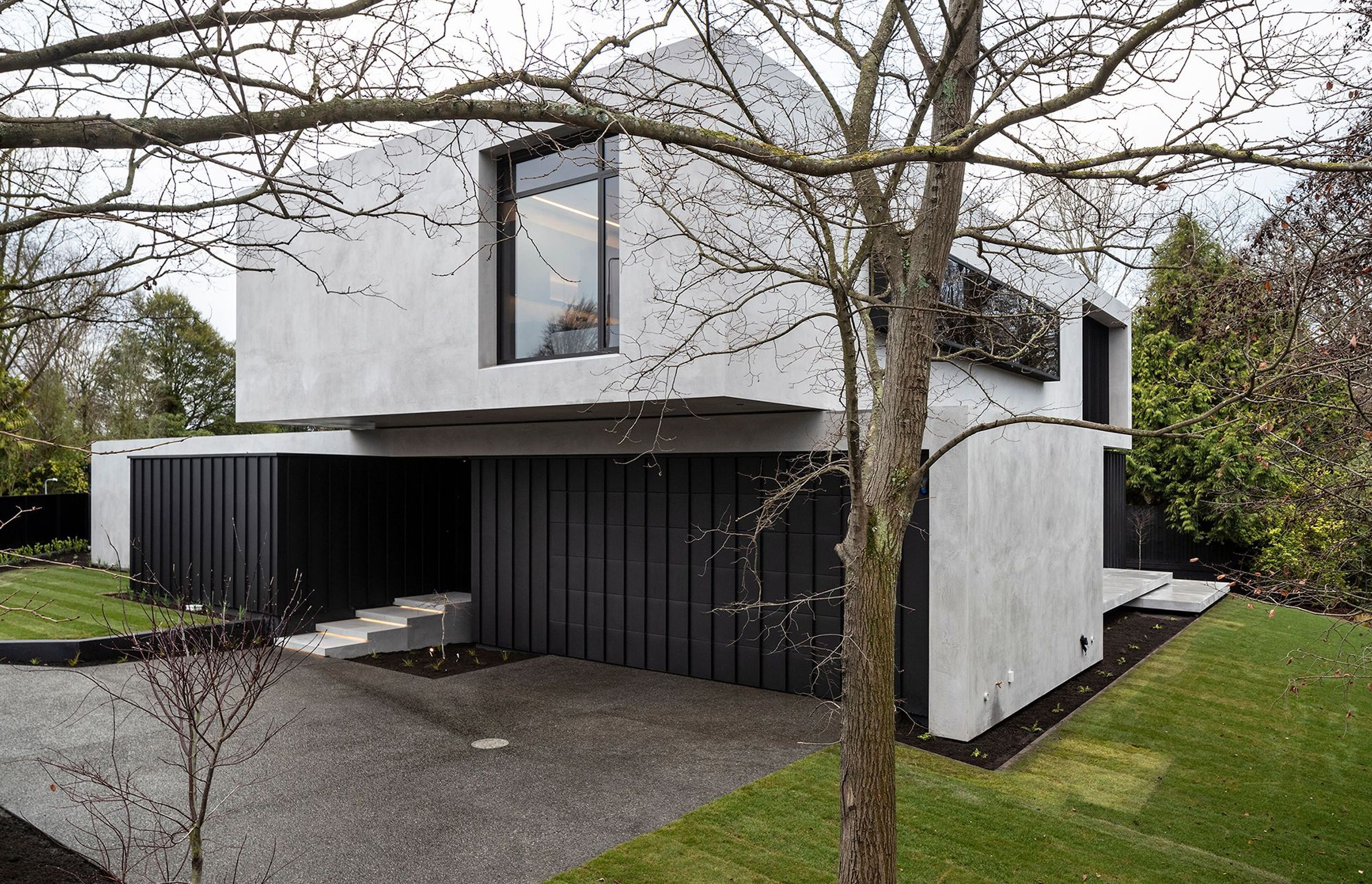 As a nod to the clients' request for a insitu concrete house, which, unfortunately, due to ground conditions was not possible, the exterior has been finished in a burnished concrete render.