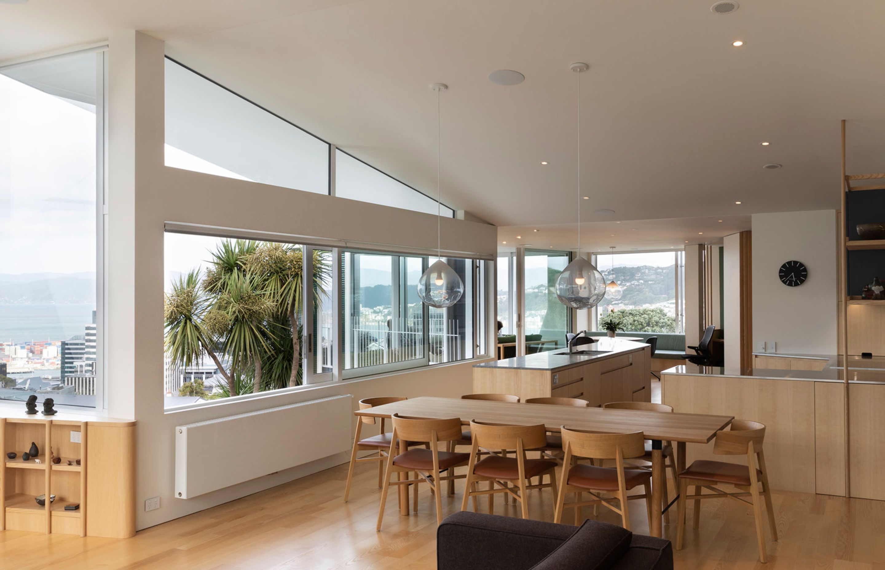 The dining area and kitchen area has a curved plan to take in the panoramic view over Wellington city and harbour.