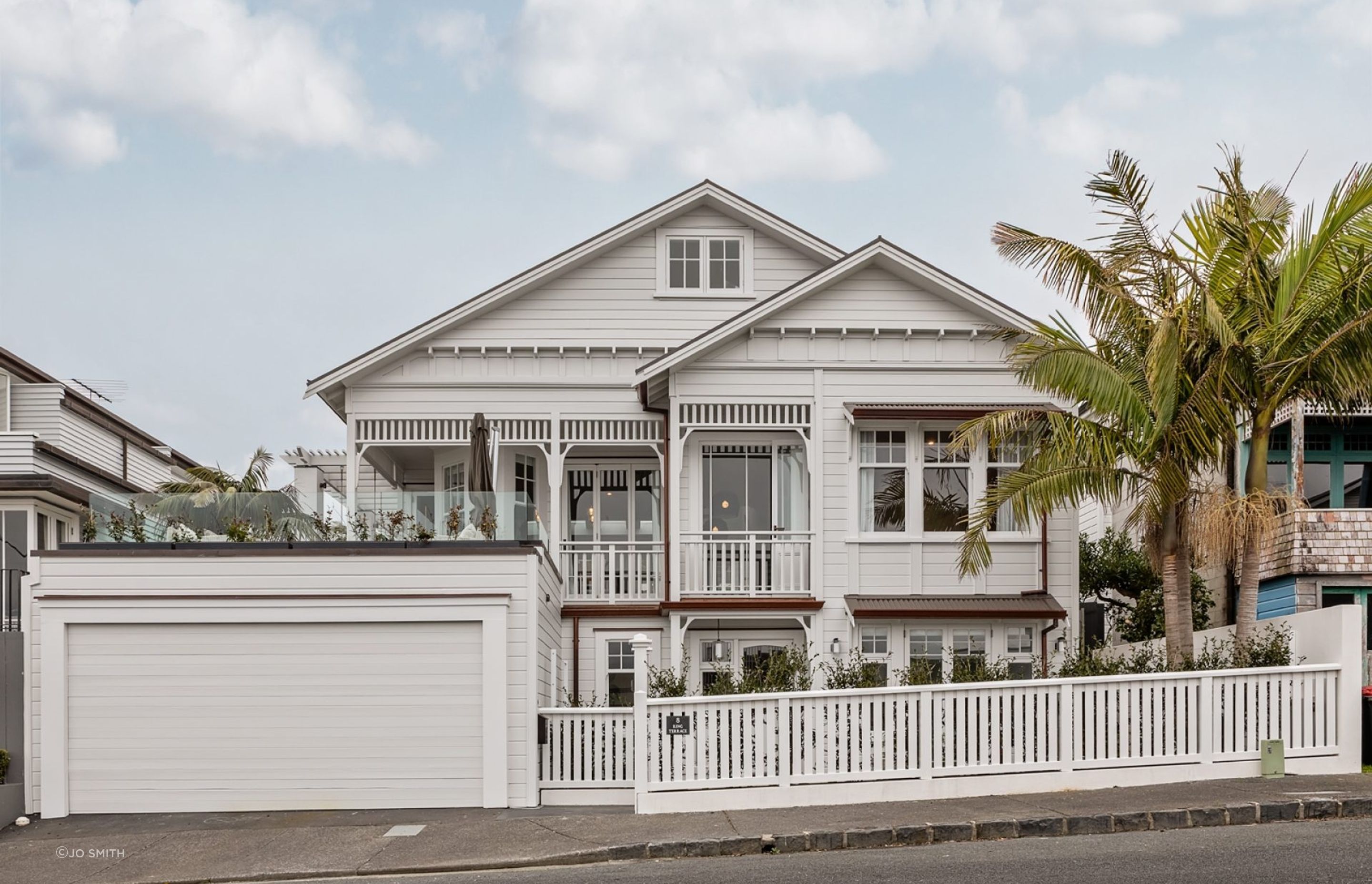 The restored house in St Marys Bay is a villa-bungalow hybrid. The corner bay within the verandah and double-hung windows are villa features, while the gable ends and front bay window are bungalow features.