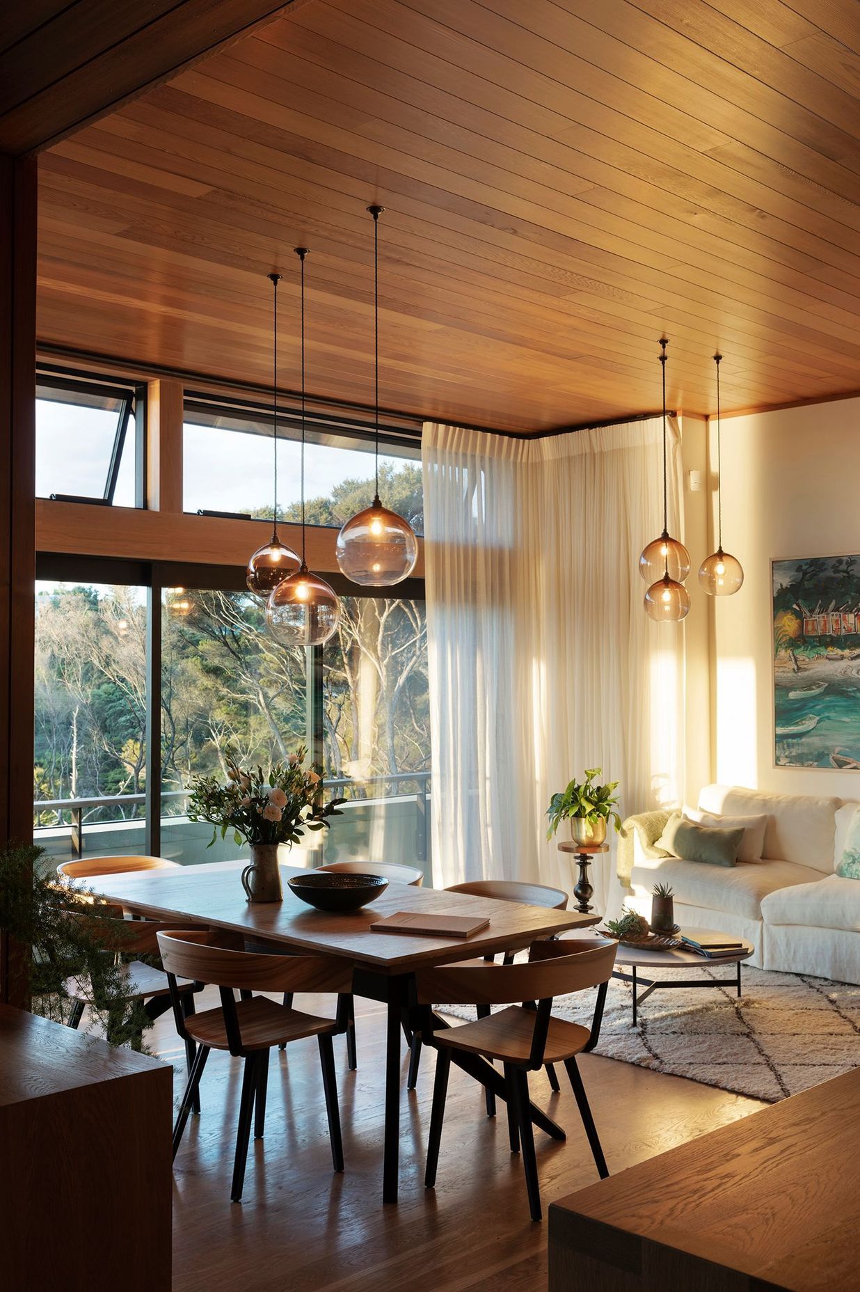 High-level windows draw light into the liviing/dining space during the winter months.