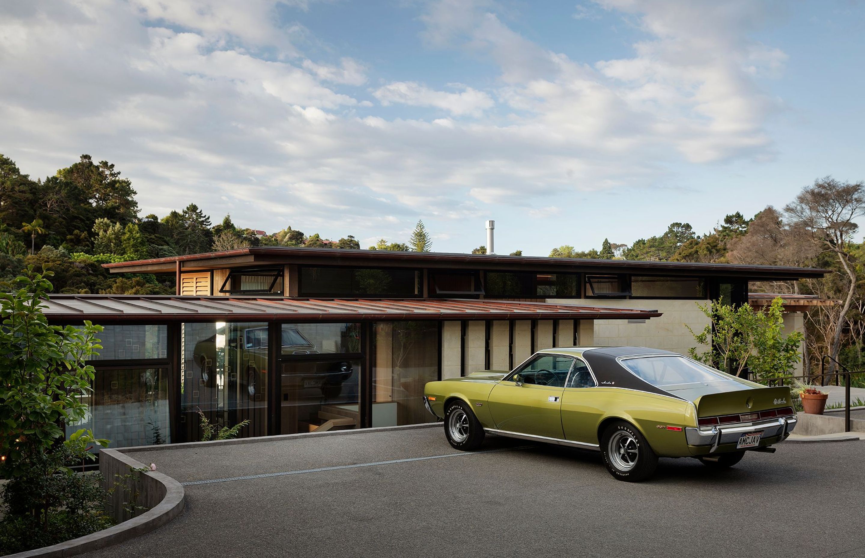The driveway to the upper level of the house. The owner's prize 'muscle car', a 1970 AMC Javelin (Mark Donohue edition SST model), takes pride of place in the driveway.