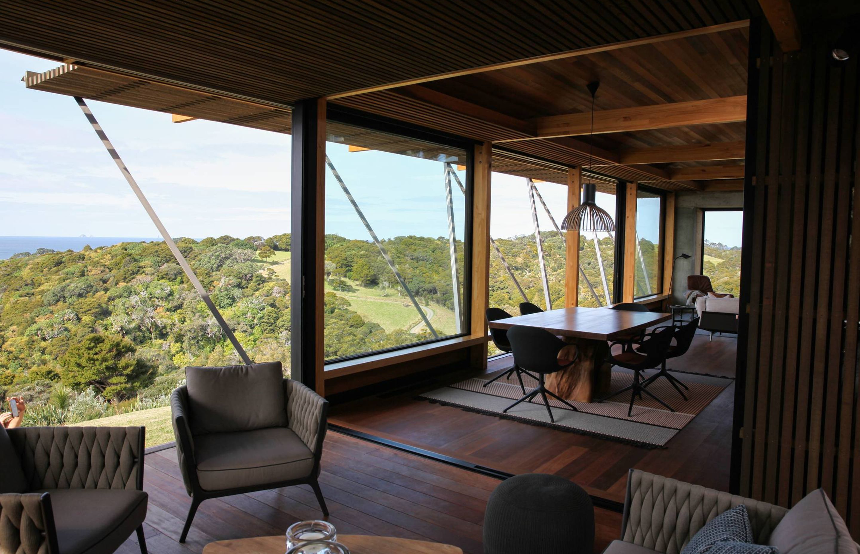 A room with a view to die for – overlooking the treetops and the ocean to Poor Knights Islands. Photograph by Jackie Meiring.