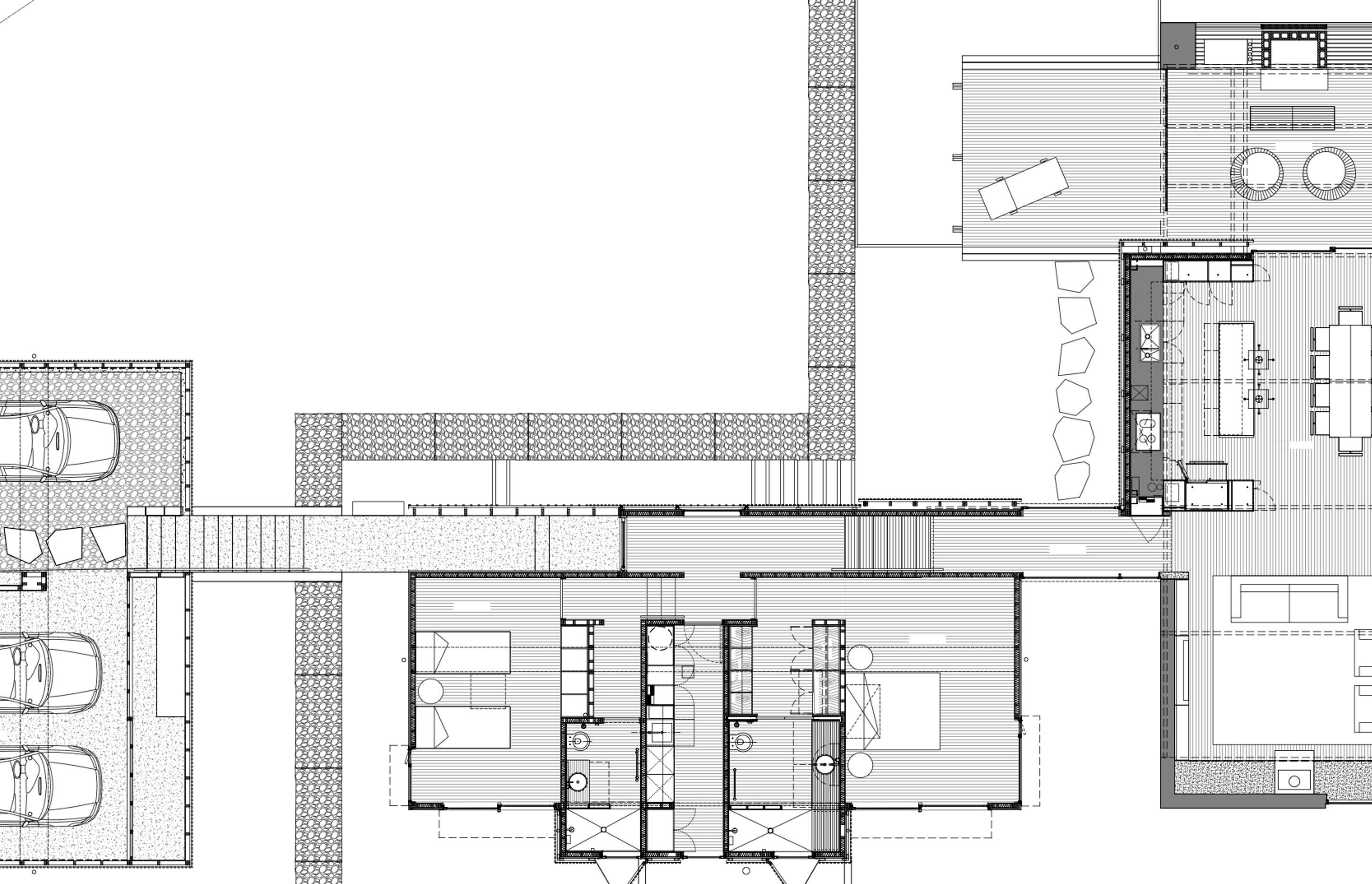 A site plan by Herbst Architects indicates the garage (left), the bedroom wing (middle), gubion retention walls, and the living spaces in the building (right), all connected by the 'spine'.