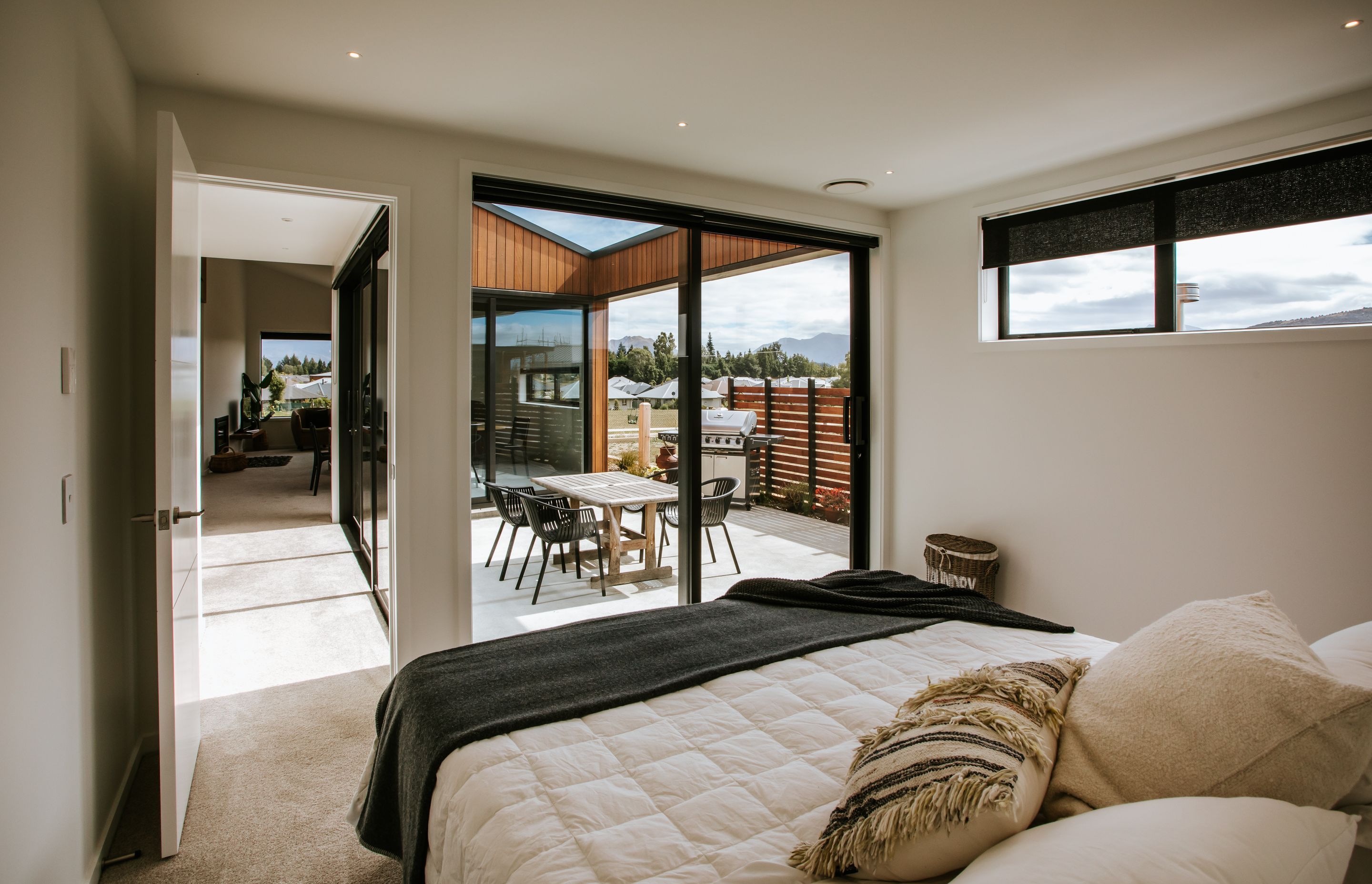 A cosy and comfortable bedroom looks out onto the external courtyard.