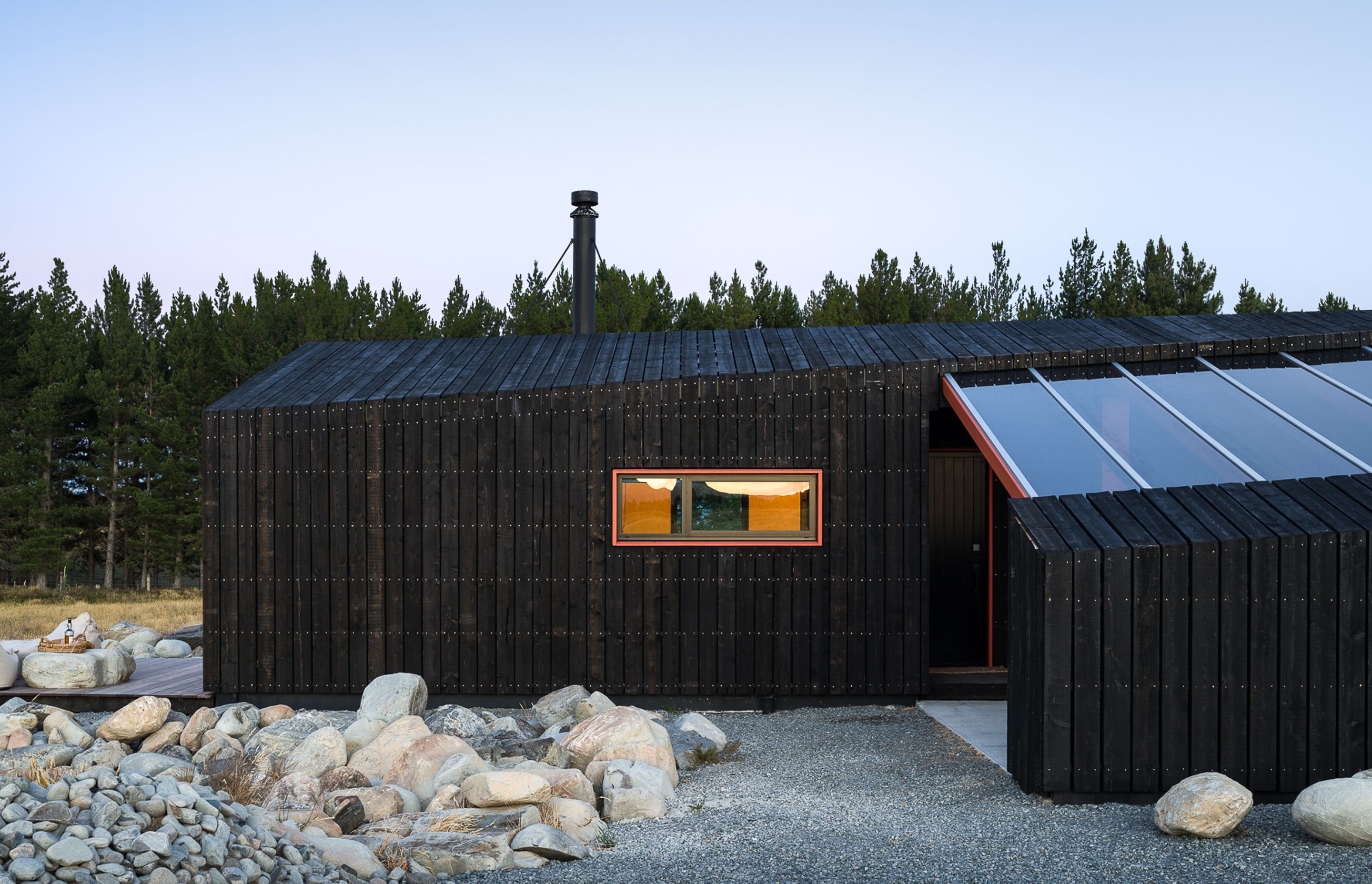 The exterior is cloaked in a rough-sawn larch timber rainscreen and represents the idea of a birds nest, which refelcts the natural aspect of the project.
