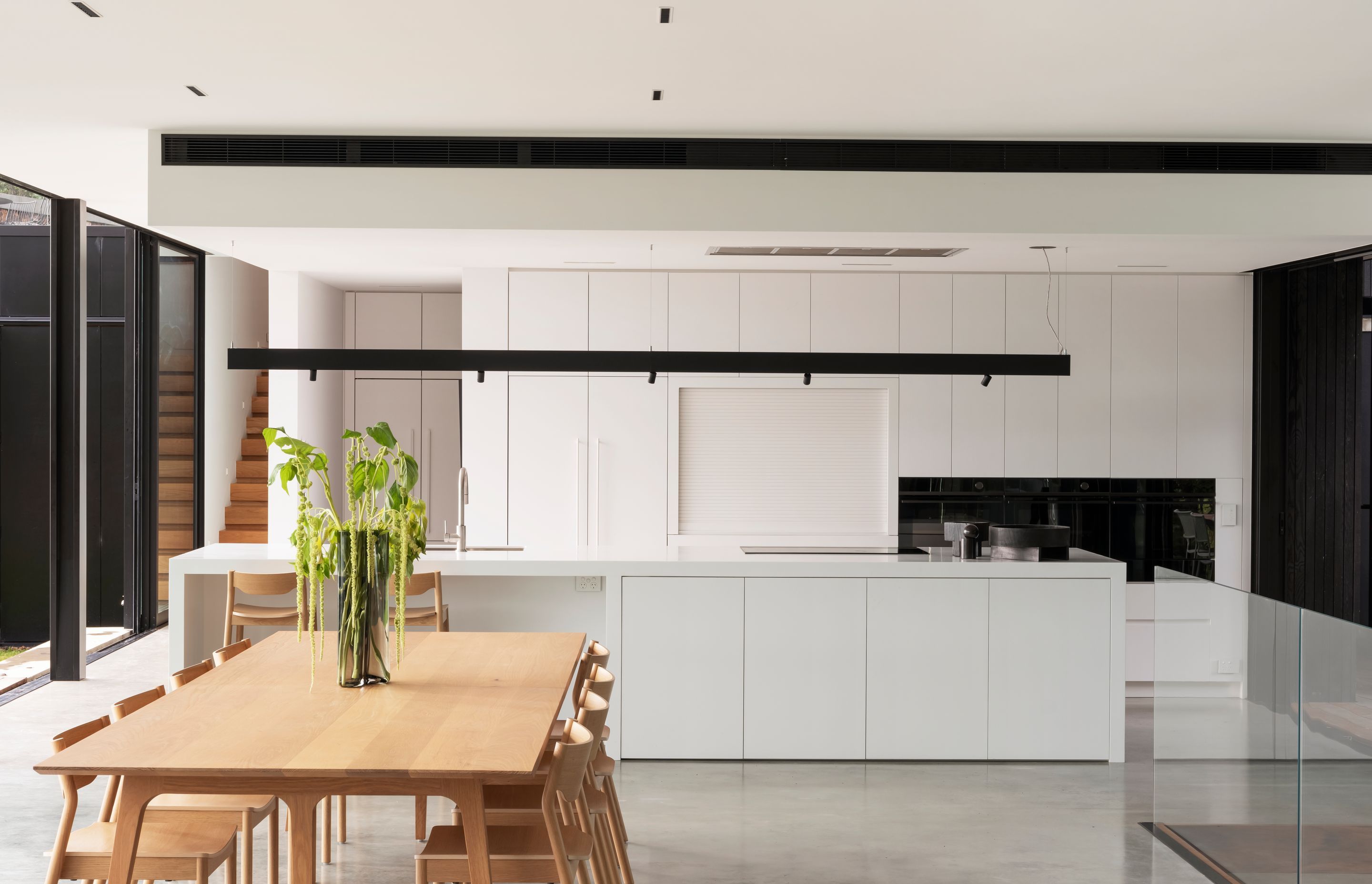 The collaboration between modern and natural lifestyle designed throughout the open plan of kitchen, living and dining.