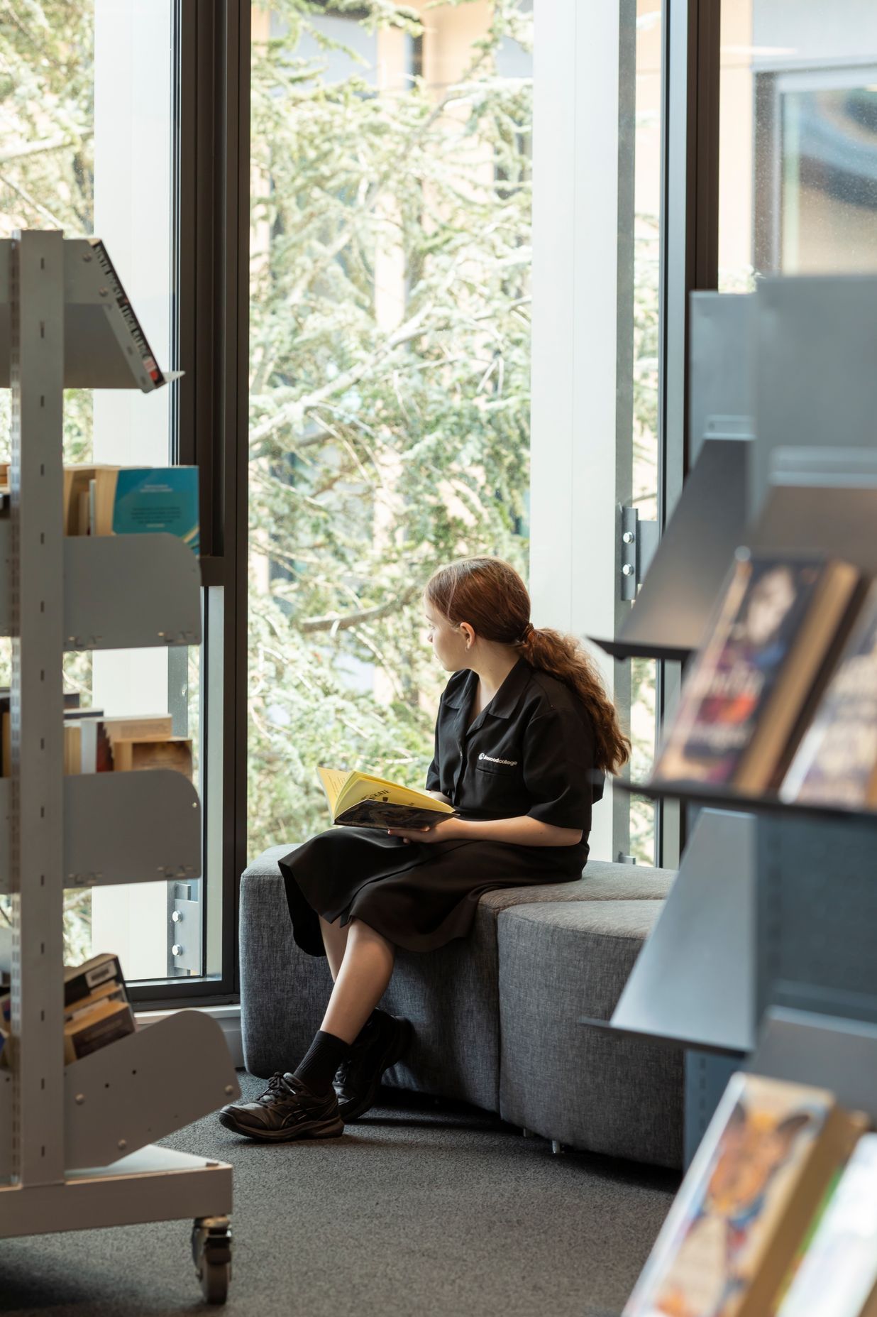 A student enjoys a quiet moment in the library.