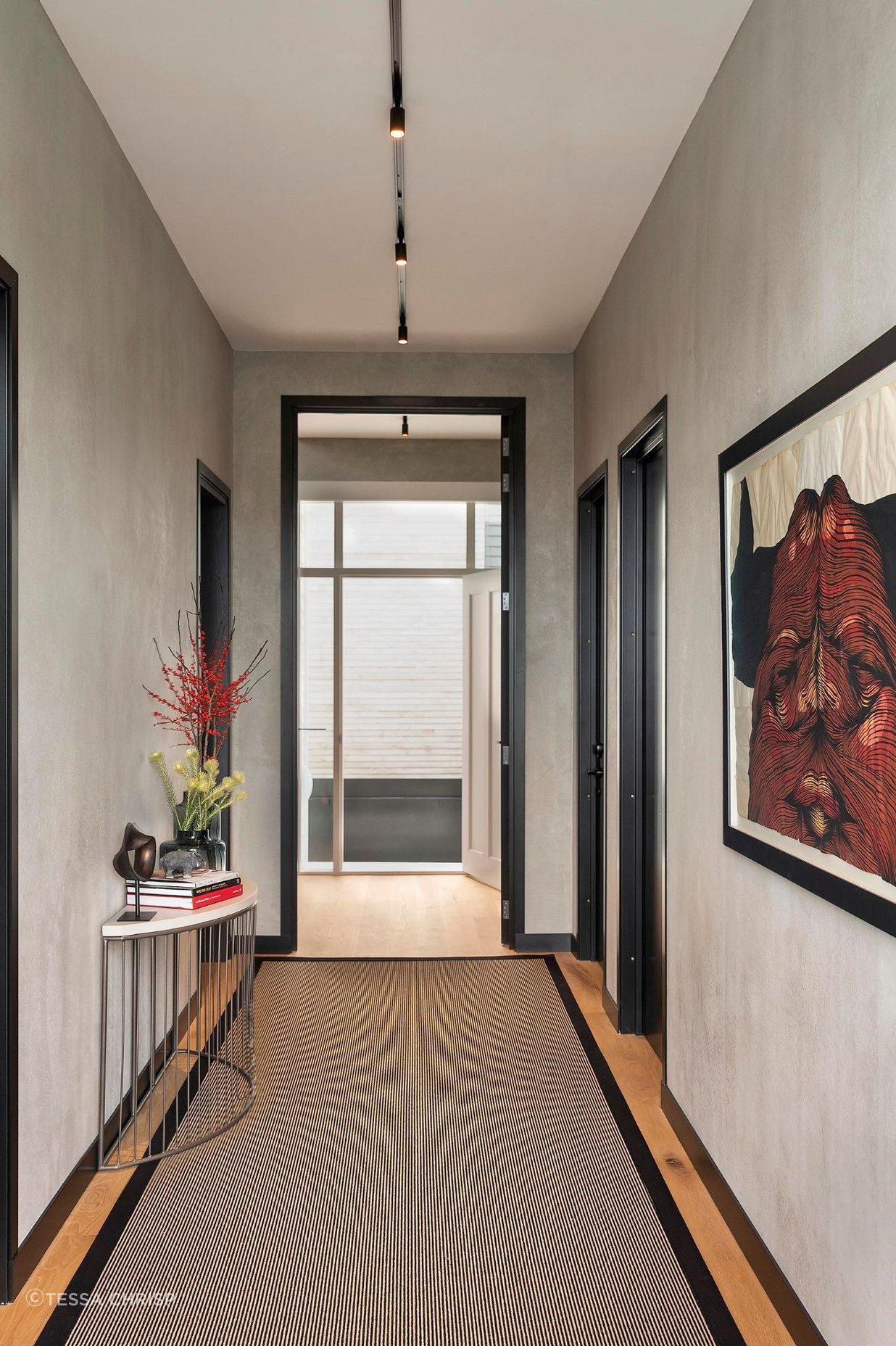 The entry hallway was elevated with textured walls and a fascinating bull artwork by David Ellis.