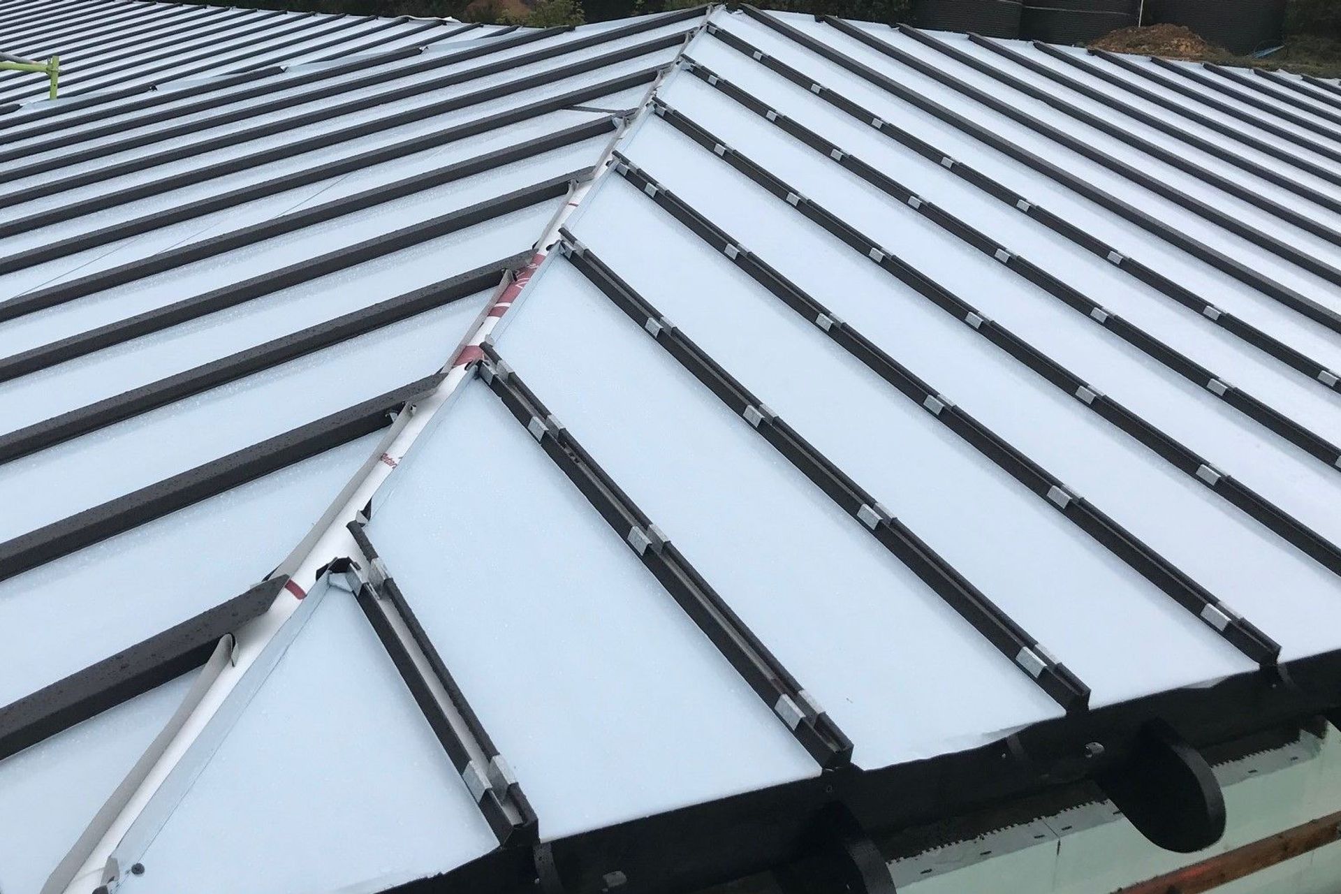 The concealed fixings where the battens are fitted. The white is the protective cover for the pan tray below.