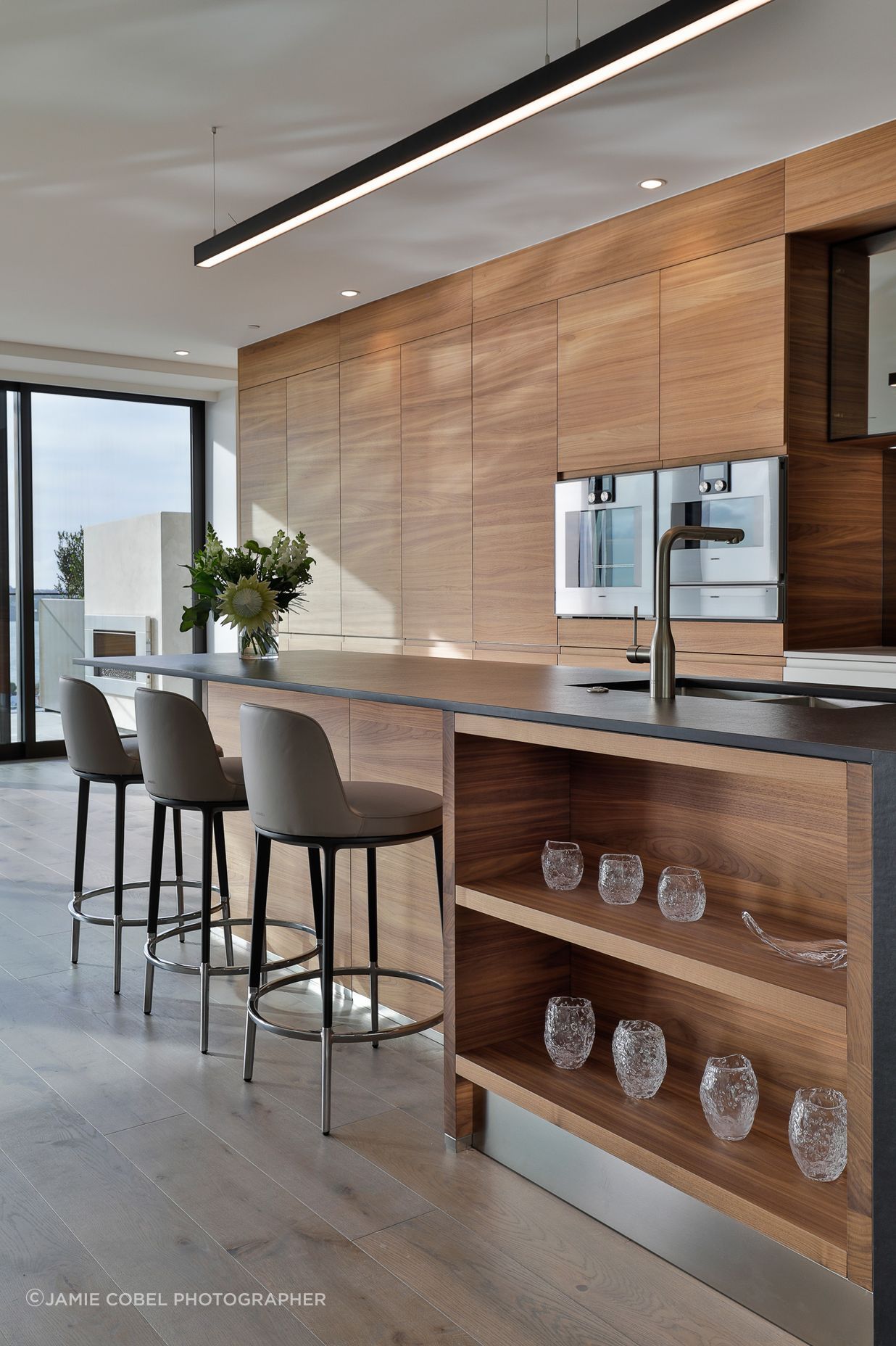 Arclinea, Convivium, featuring the elegant Canaletto American Walnut Tall and Wall units.