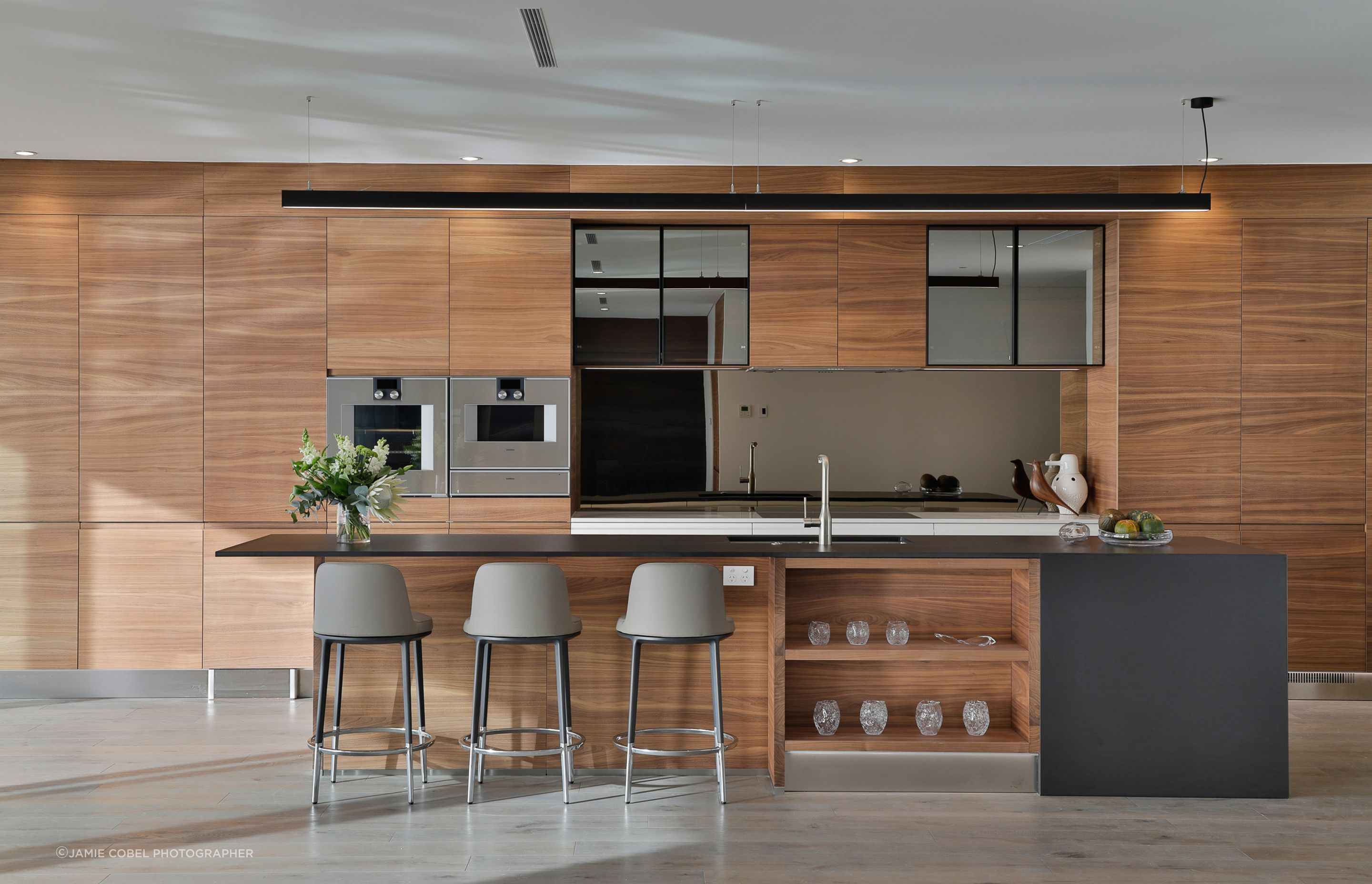 Arclinea, Convivium, featuring the elegant Canaletto American Walnut Tall and Wall units.