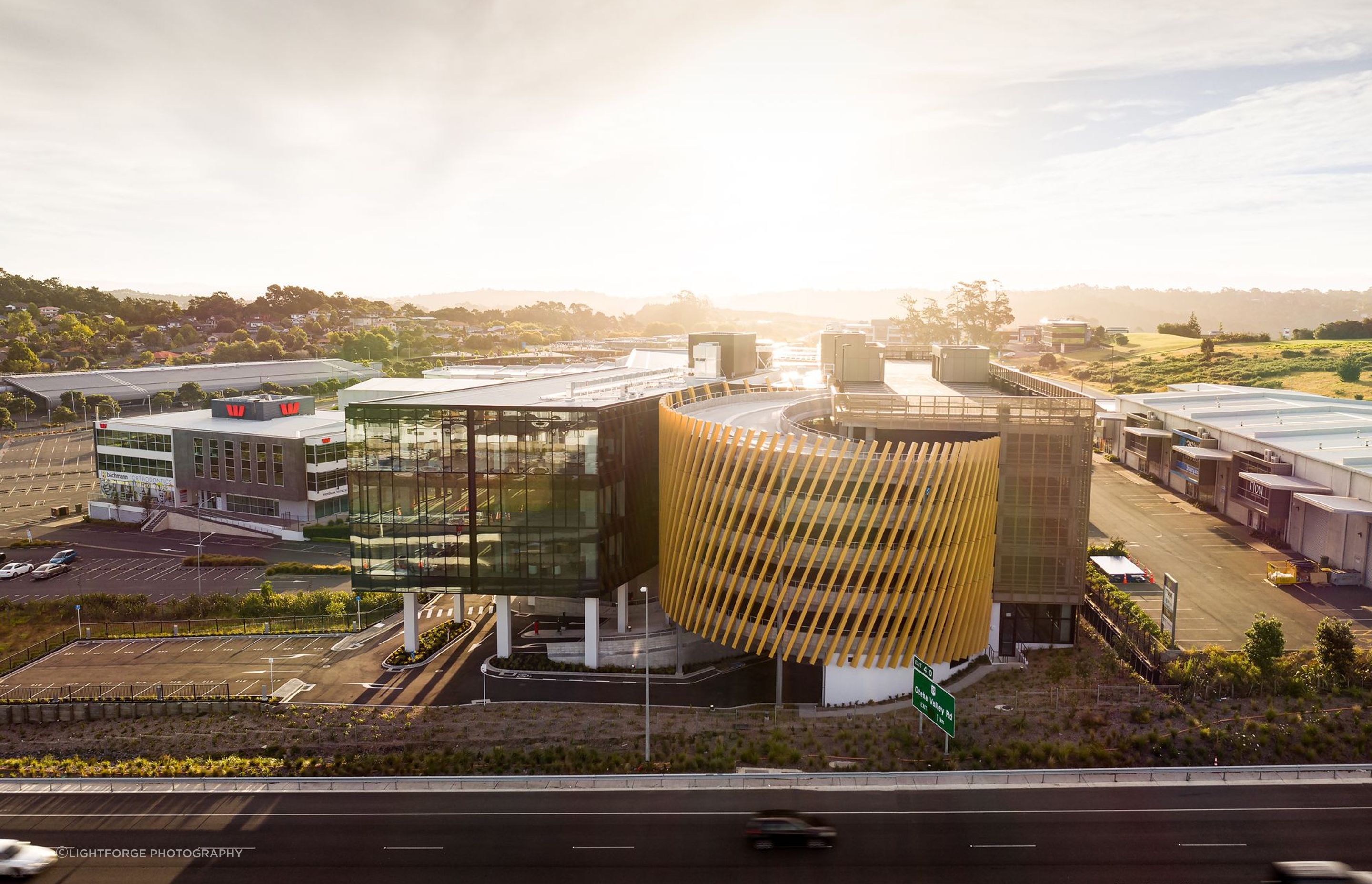 Seen from the Northern Motorway, the huge expanse of glazing and the gold fins on the spiraling car parking ramp mean 55 Corinthian Drive has become a landmark.