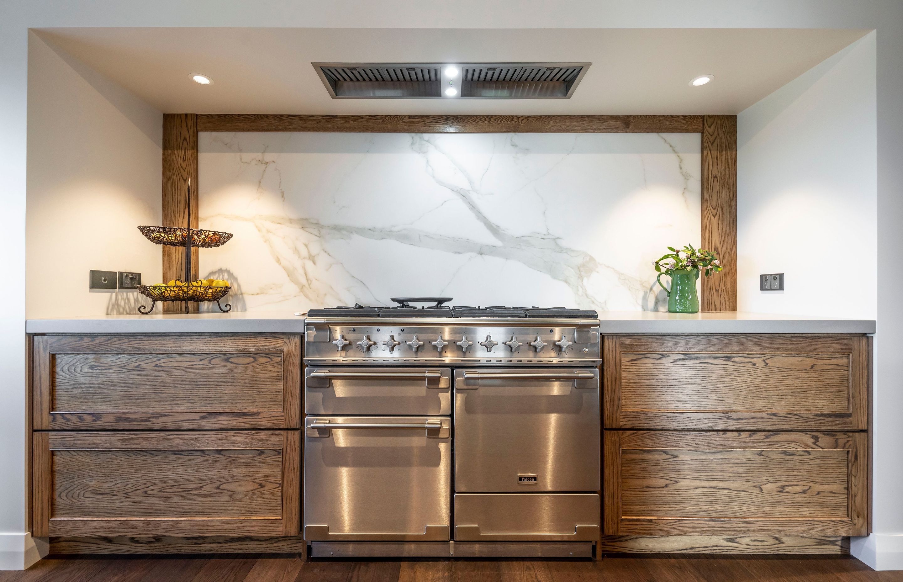 Natural materials sit side-by-side with industrial elements creating a sophisticated cooking zone in the kitchen.