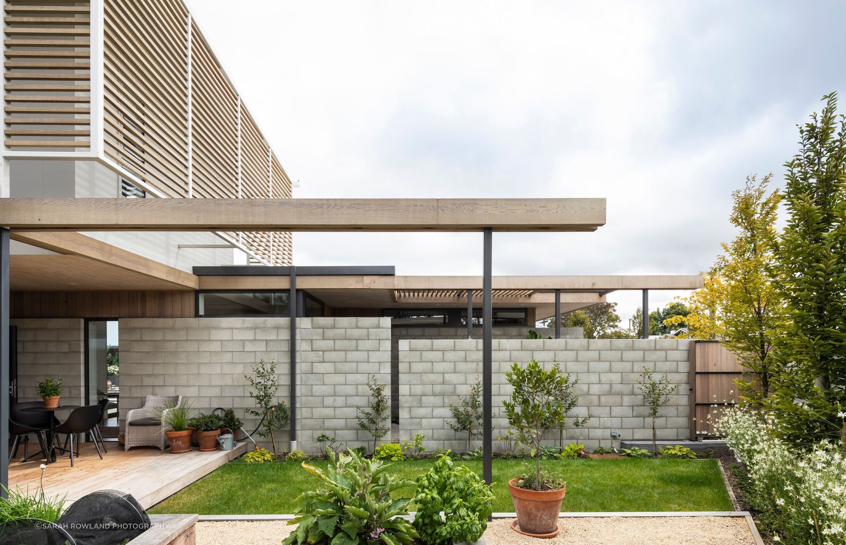 To answer the clients' brief for a comfortable, 'easy to live in' home, a simple palette of natural, low-maintenance materials—cedar, concrete block and fibre cement boards—was specified.