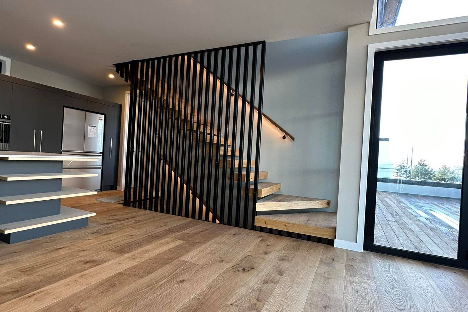 Black steel fins make for an amazing feature on the internal stairs