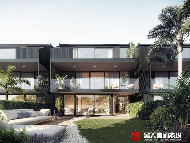 A contemporary multi-level residential development viewed from a landscaped courtyard, featuring dark vertical cladding, extensive floor-to-ceiling glazing, projecting balconies, deep roof overhangs, and lush tropical planting. Outdoor lounge furniture and a manicured lawn occupy the foreground.