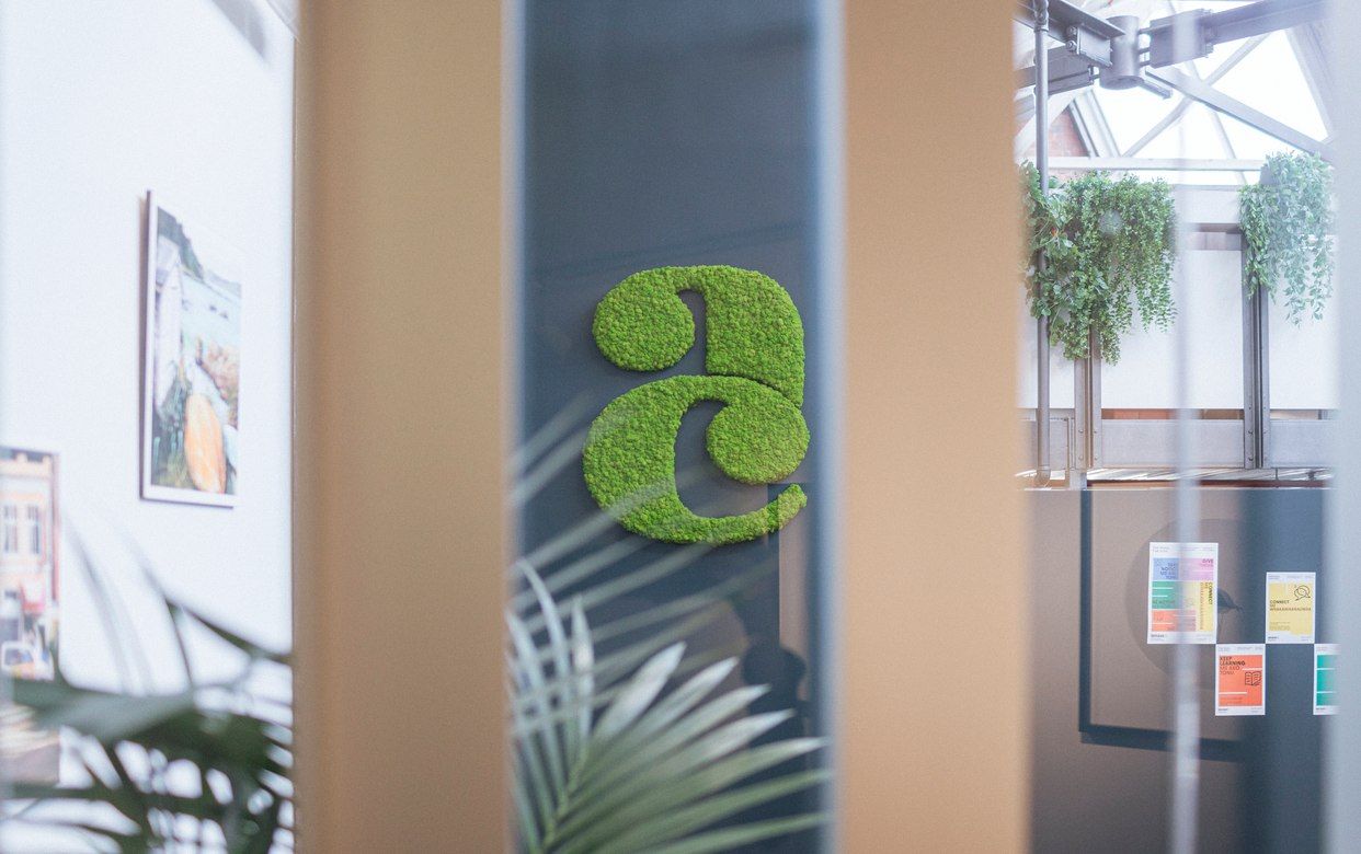 Elevated Moss Logo for Allen + Clarke: A Fusion of Nature and Brand Identity