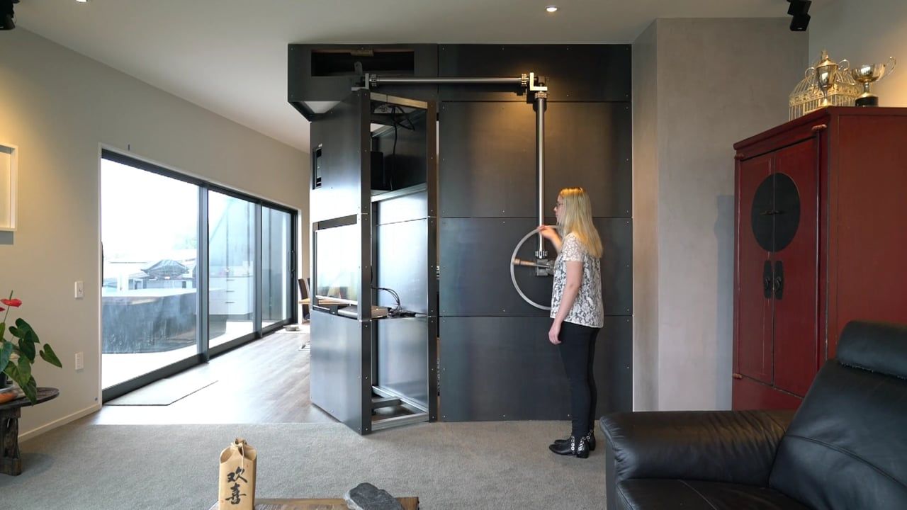 A bespoke design by Peter Dunbar for a wheel pivoting steel wall which includes a TV and air-conditioning unit. video