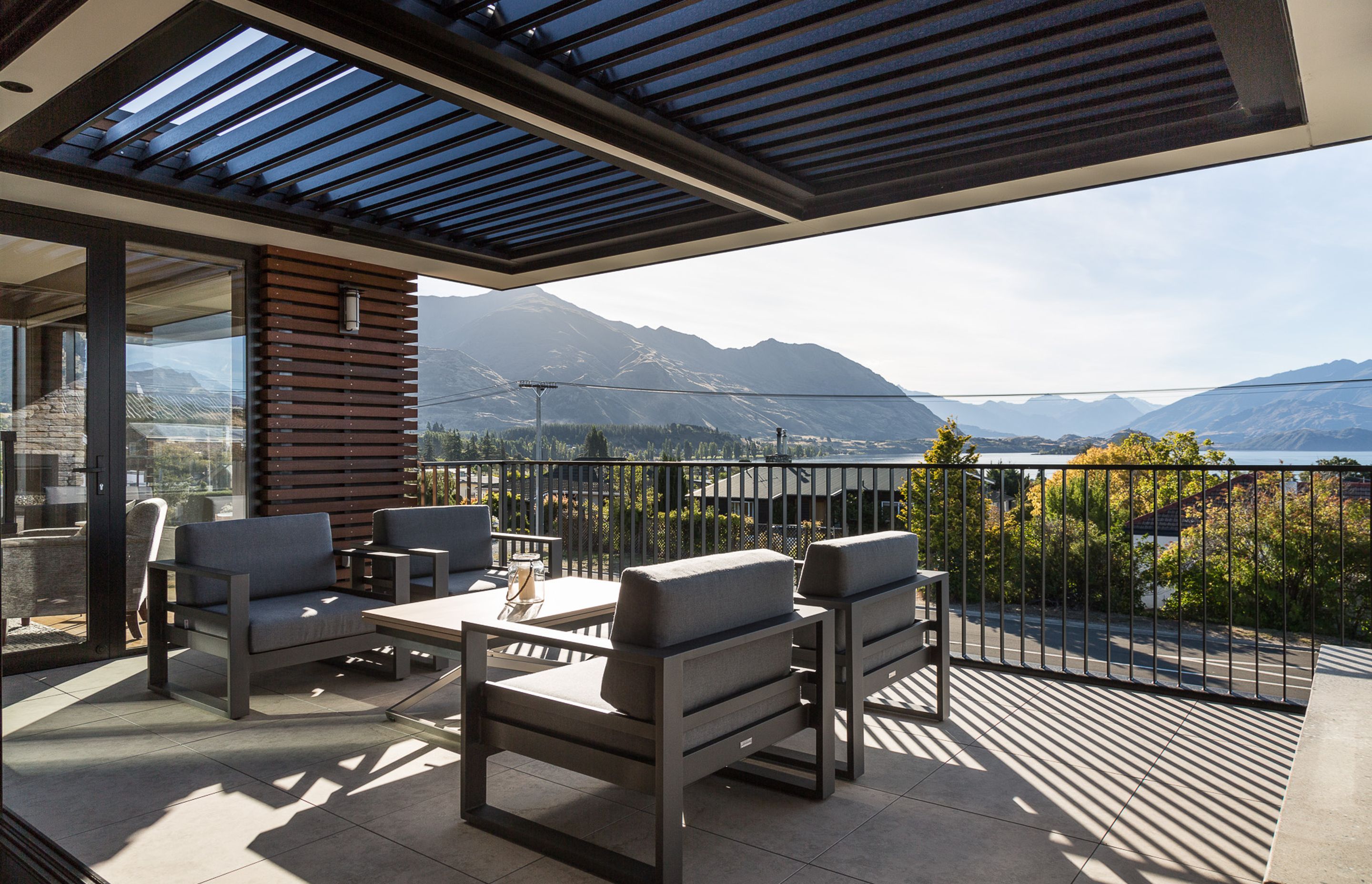 Enclosed on three sides and capped off with a louvred roof, the terrace has the feeling of being an outdoor room. Additional access is also possible from one of the main bedrooms.