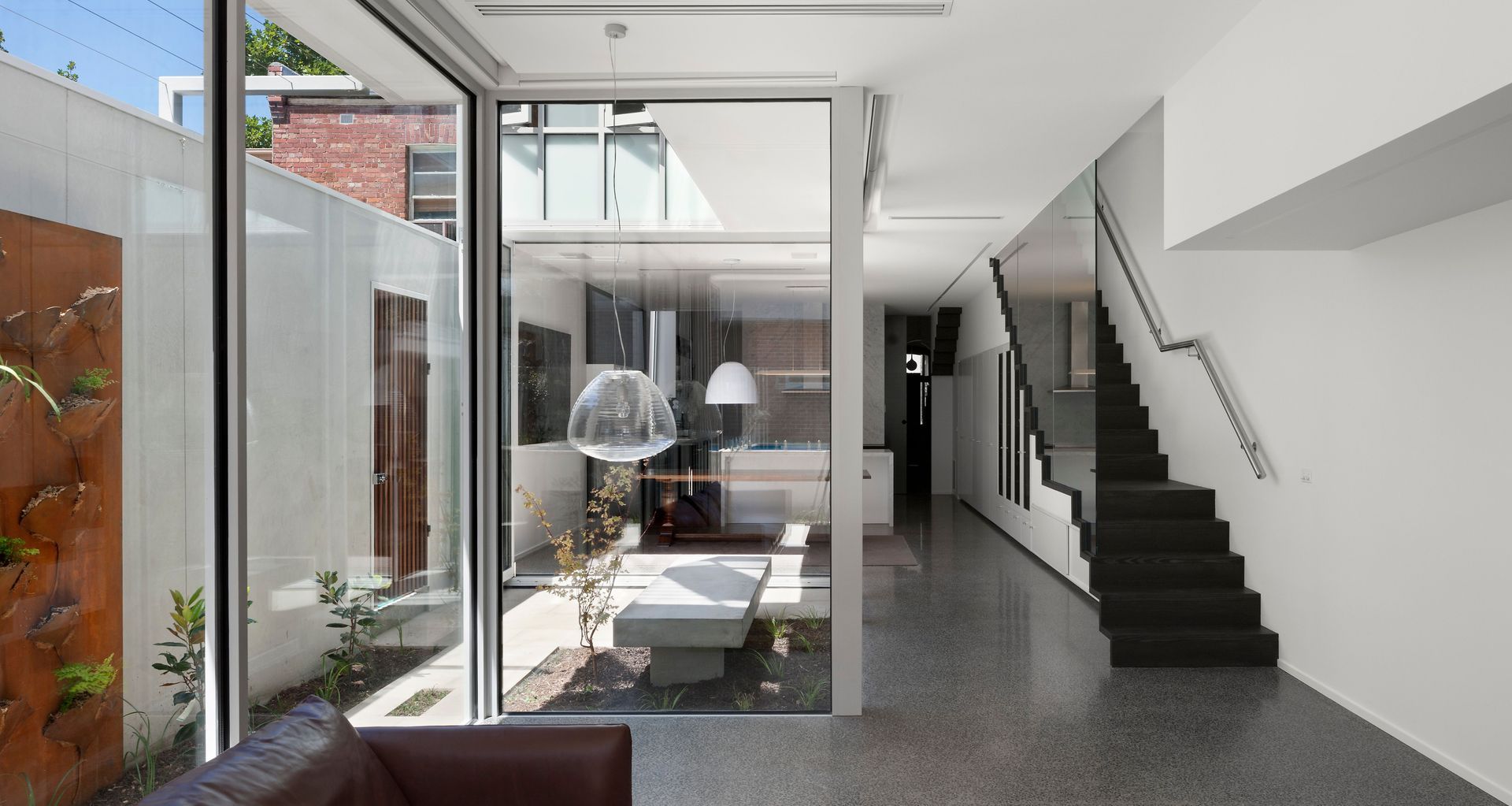 “We imagined the greenery climbing up through the windows,” says May.