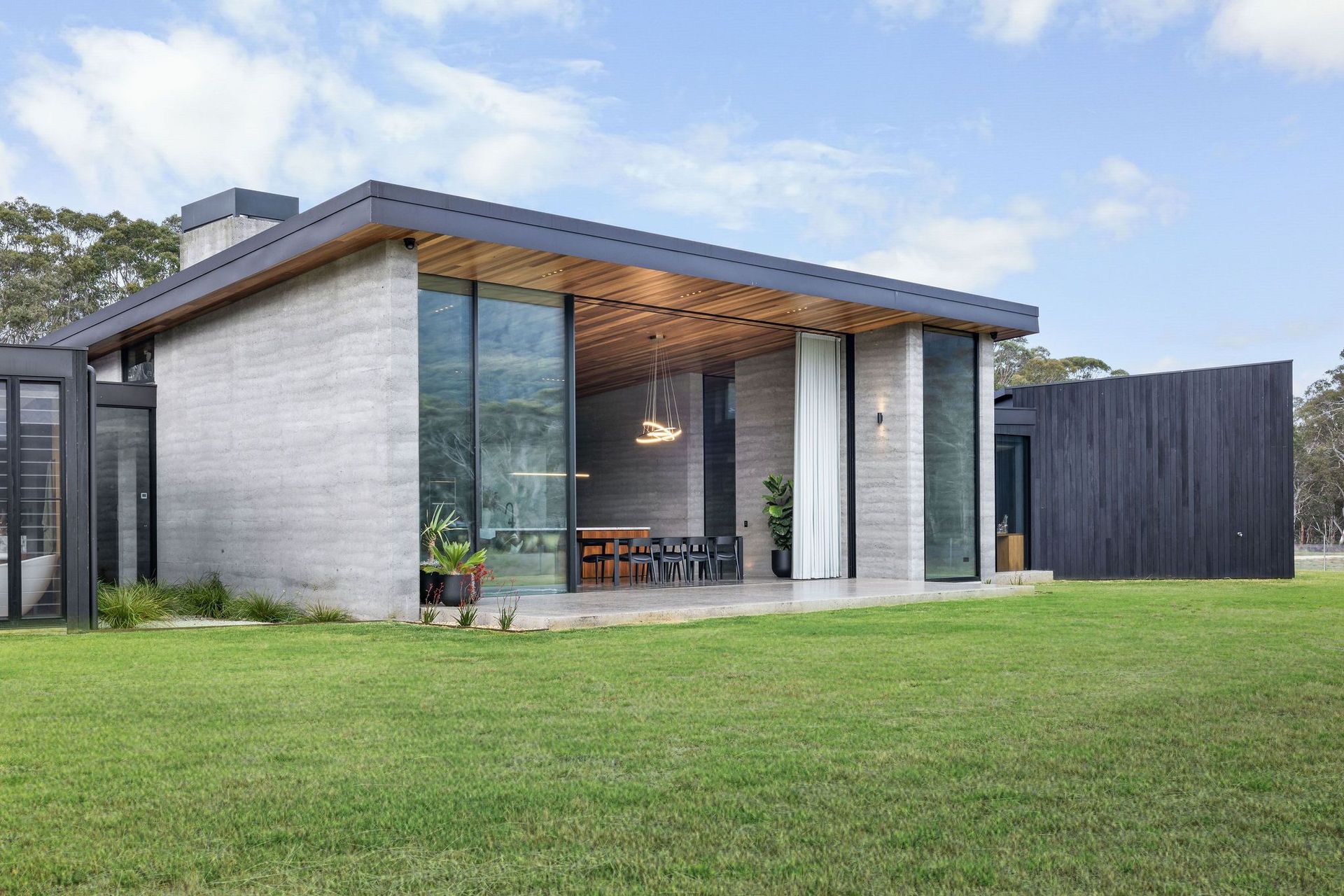 The position of a glass facade and entrance foyer frames the escarpment in a way that captivates the viewer and draws you in.