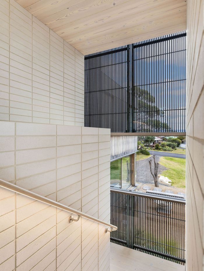 The space is enhanced by the soft, muted palette of whites, creams, sand tones and light timbers.