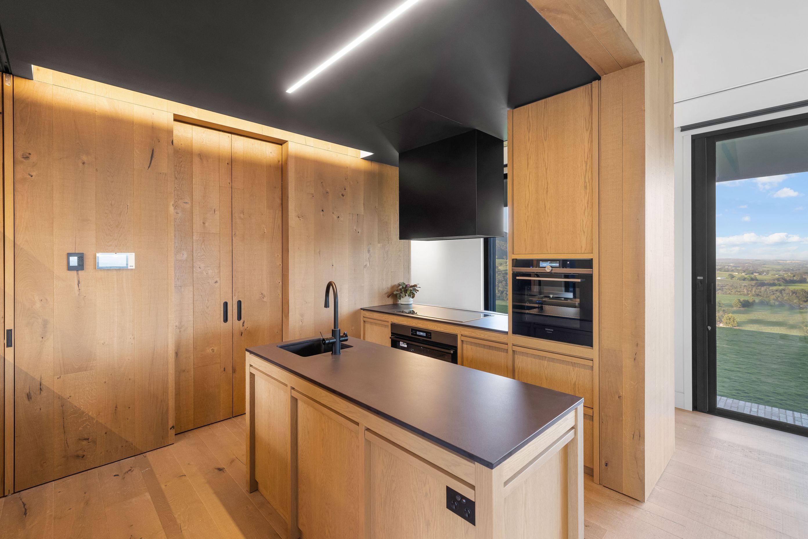 The timber kitchen with rich dark accents