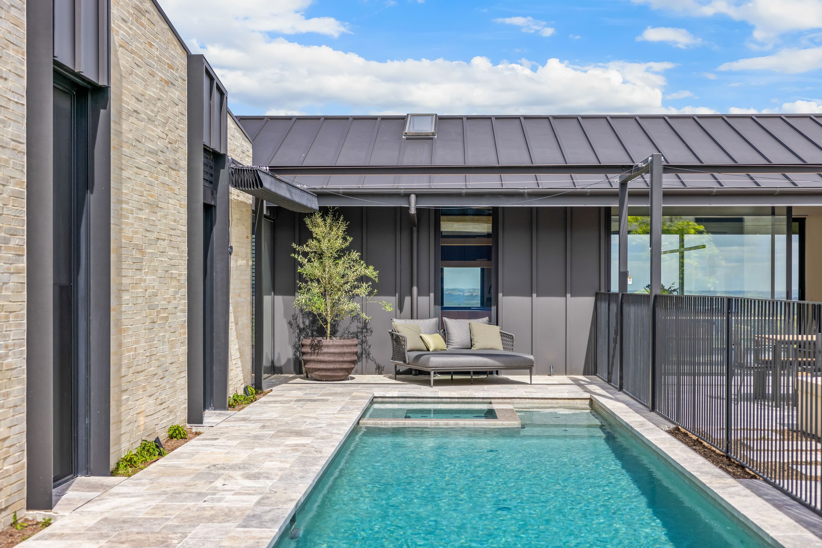 An enticing pool sits to side of the central courtyard