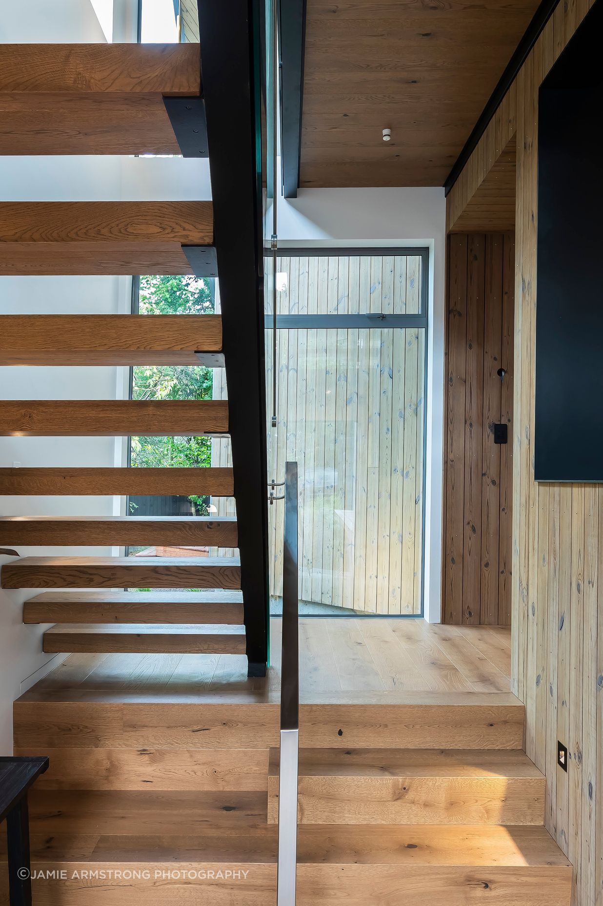 The abundance of timber materiality adds warmth to the modern interiors.