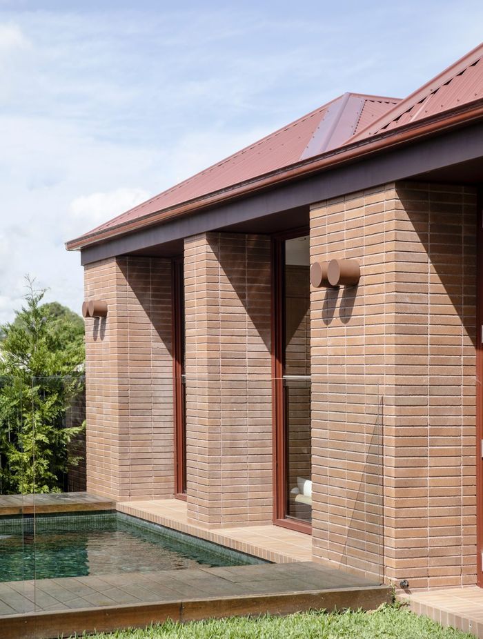 The new addition connects to the landscape and pool.