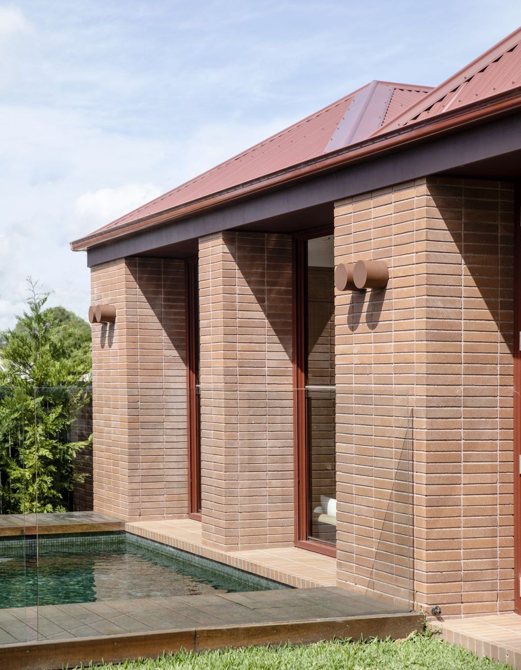 The new addition connects to the landscape and pool.