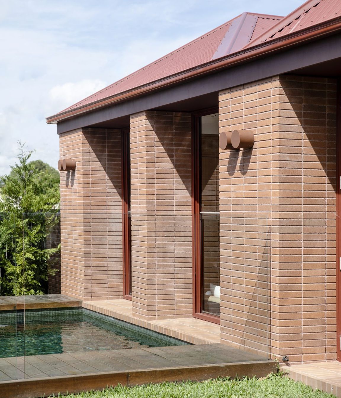 The new addition connects to the landscape and pool.
