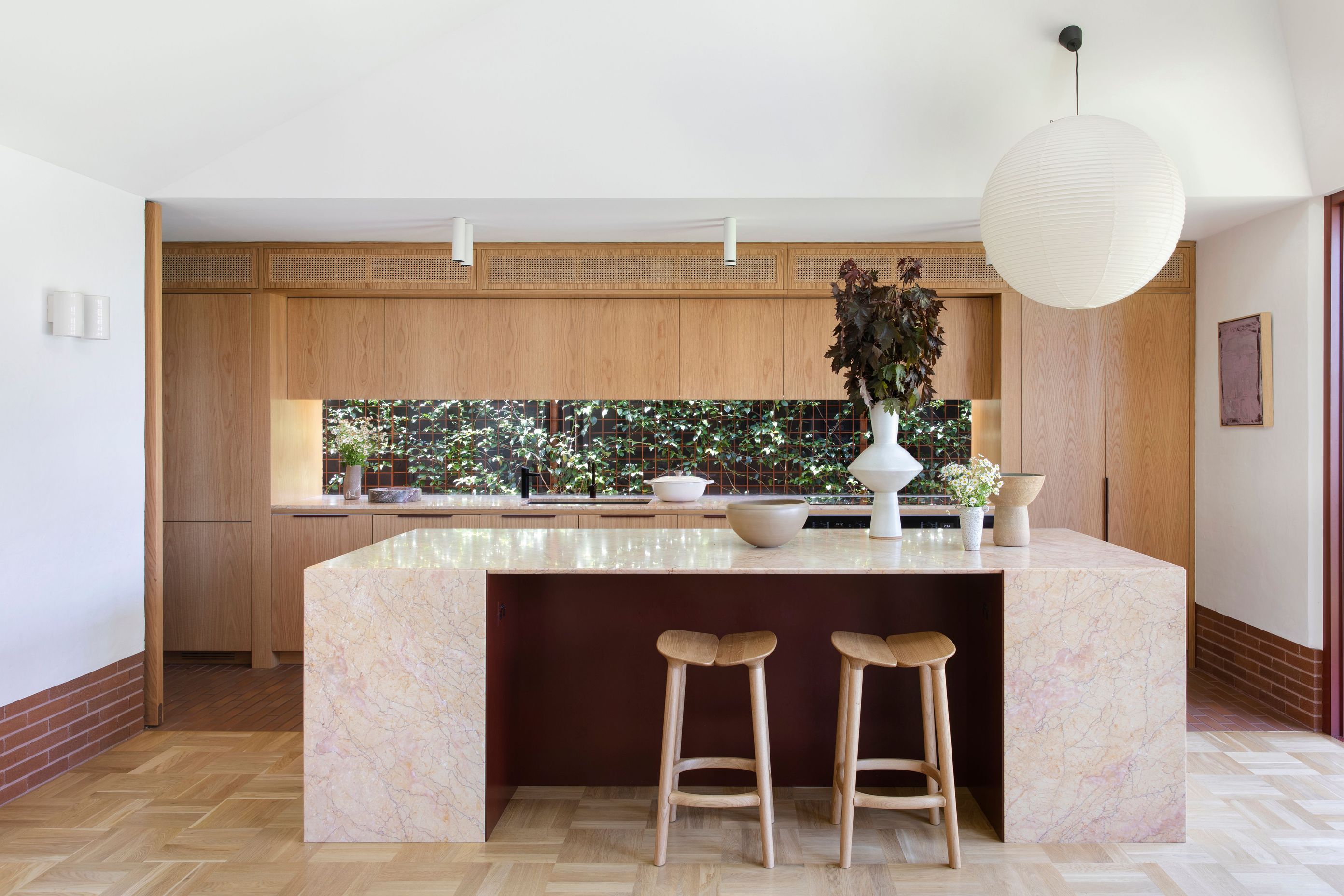 Subtle transitions in flooring throughout the home; brick, terrazzo, parquetry and traditional timber boards.