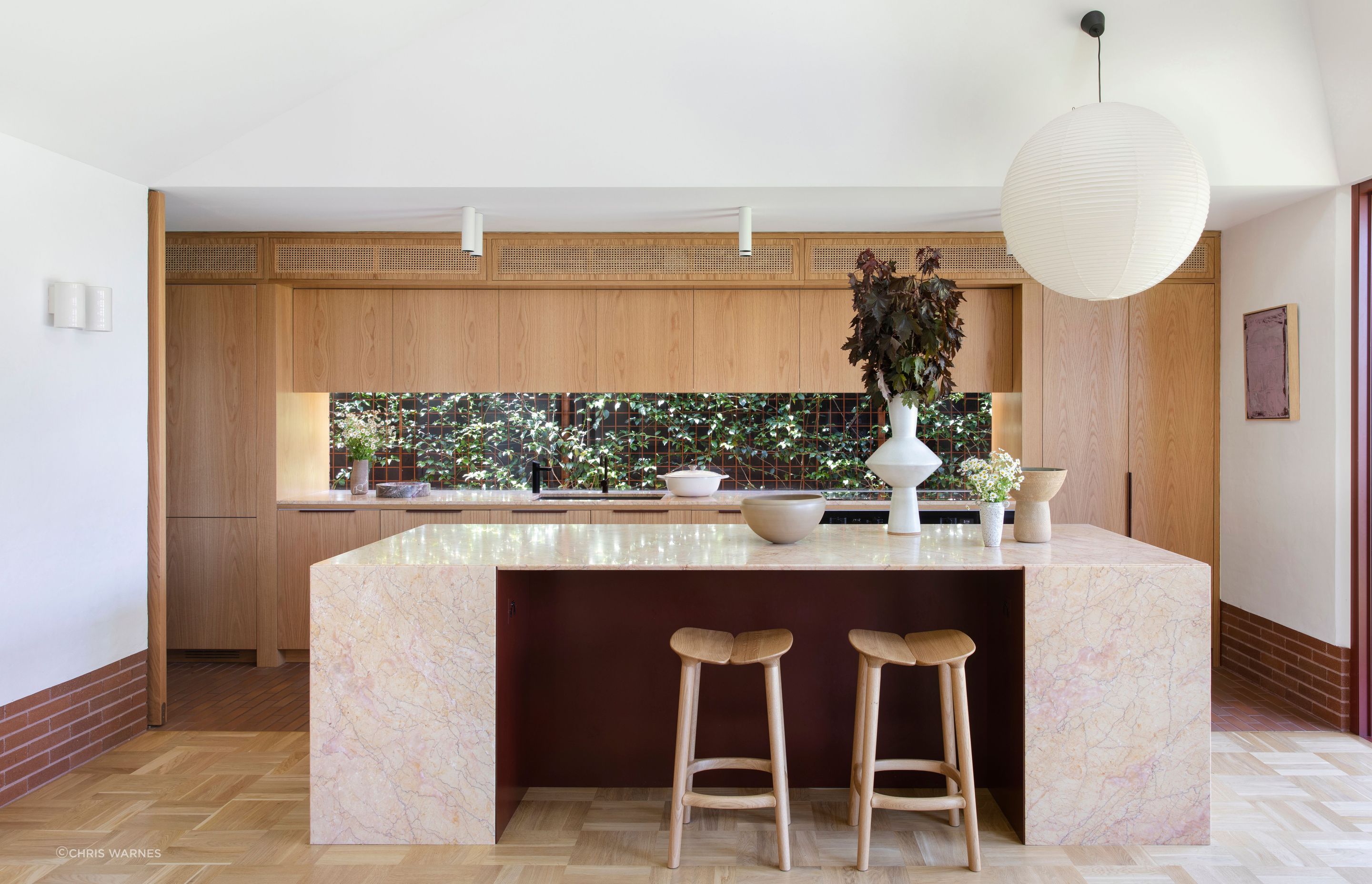 Subtle transitions in flooring throughout the home; brick, terrazzo, parquetry and traditional timber boards.