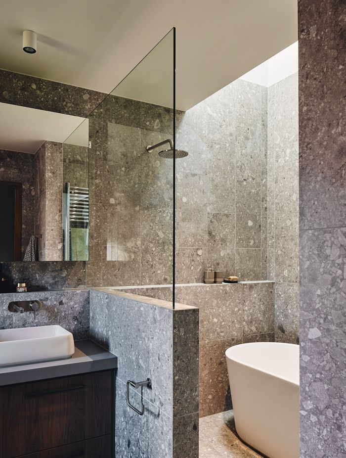 The design approach interplays a variety of eclectic materials and interesting elements.