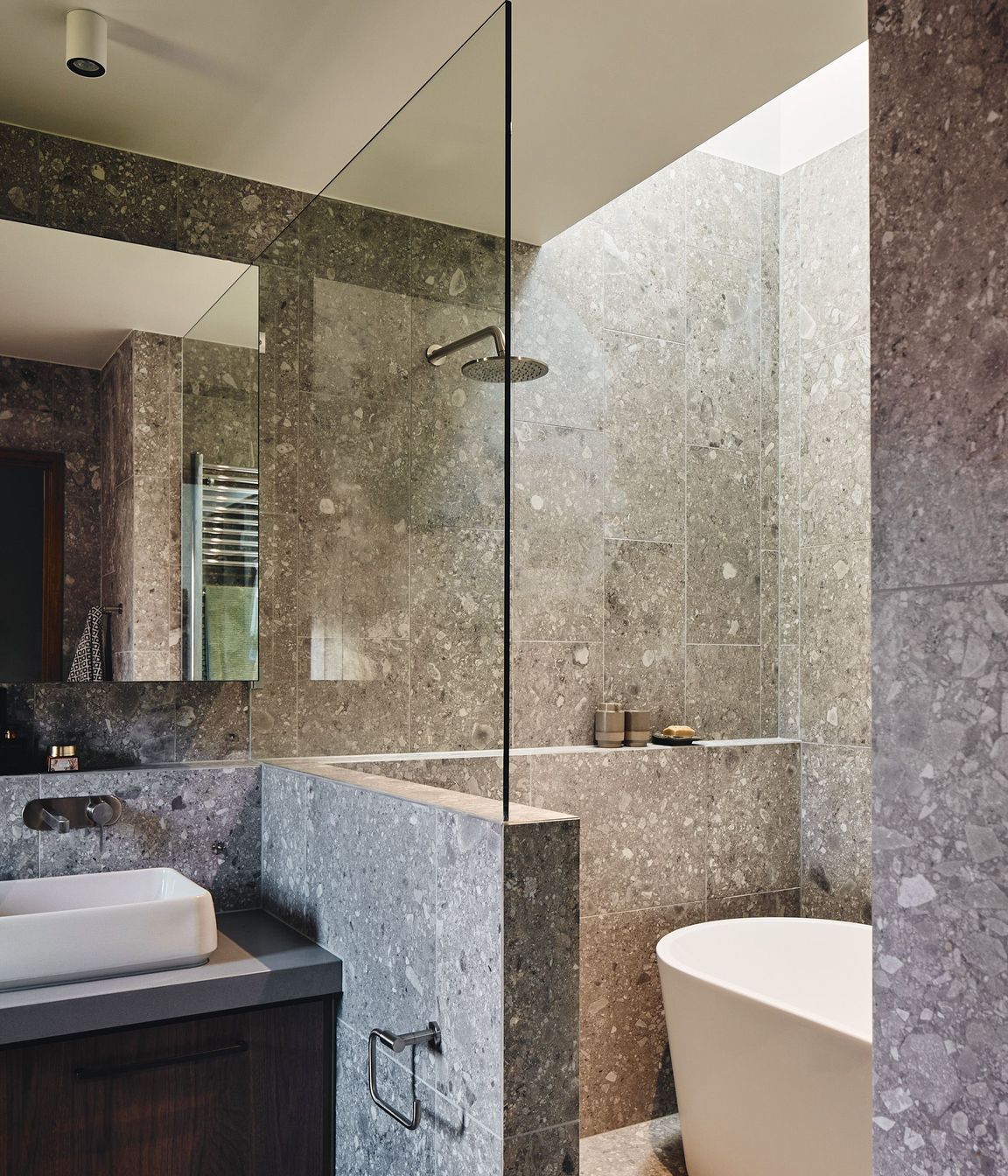 The design approach interplays a variety of eclectic materials and interesting elements.