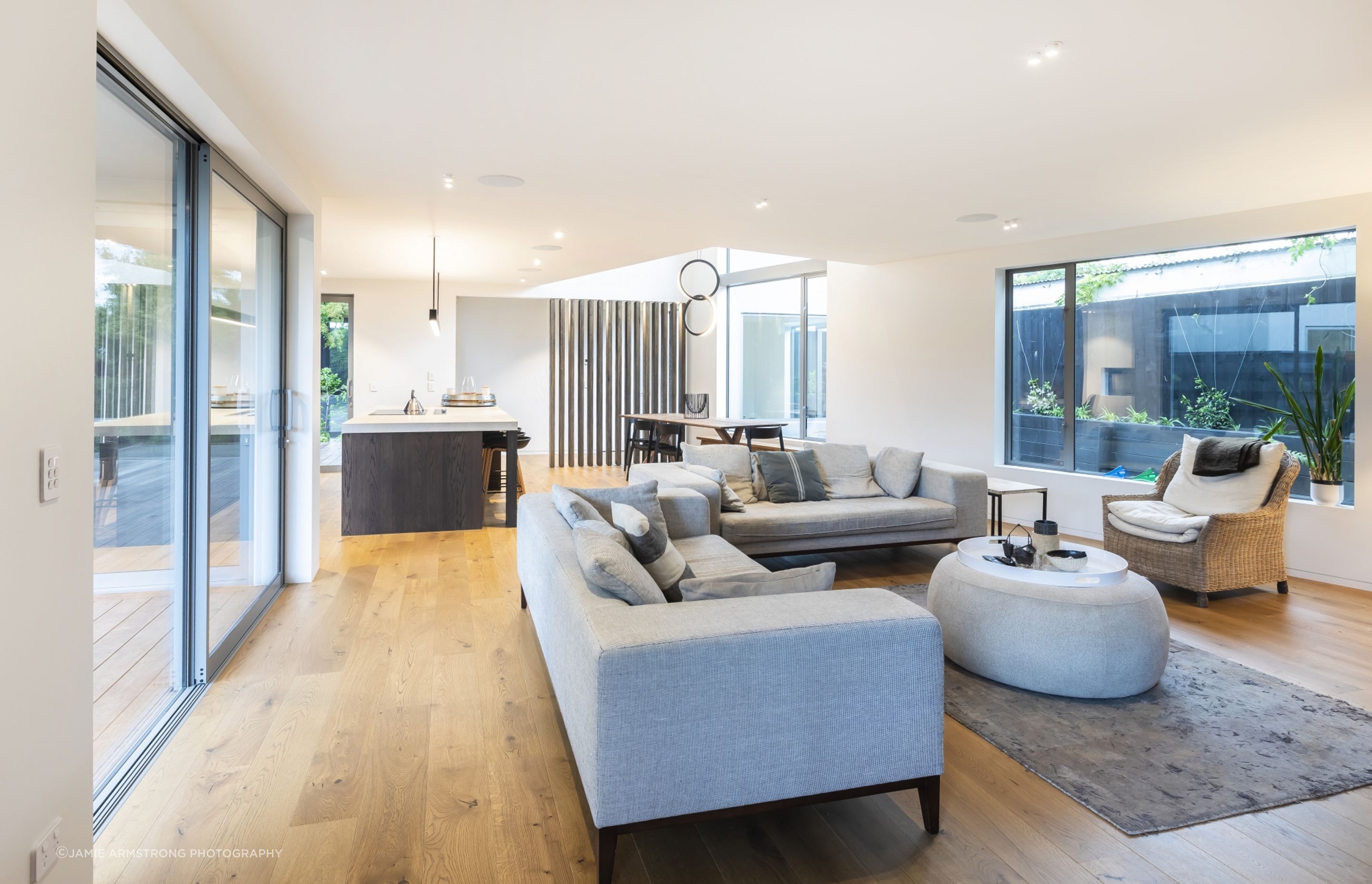 The architectural design of the houses is characterised by angular shapes and intriguing voids.
