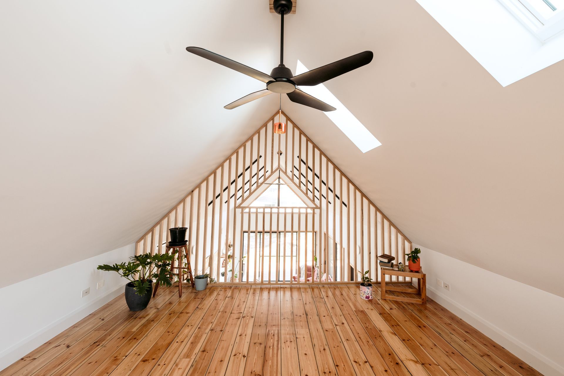 The loft flooring is recycled floorboards from the original asbestos shack on the property.